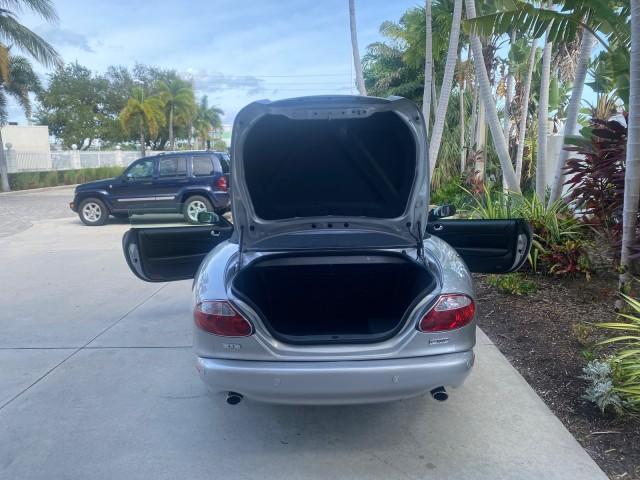 2004 Quartz /Charcoal Jaguar XK8 CONV LOW MILES 22,152 (SAJDA42CX42) with an 4.2L DOHC EFI 32-Valve Aluminum Alloy V8 Engine engine, Automatic transmission, located at 4701 North Dixie Hwy, Pompano Beach, FL, 33064, (954) 422-2889, 26.240938, -80.123474 - OUR WEBPAGE FLORIDACARS1.COM HAS OVER 100 PHOTOS AND FREE CARFAX LINK 2004 JAGUAR XK-SERIES XK8 $ 75,530 NEW VIN: SAJDA42CX42A37634 S A J D A 4 2 C X 4 2 A 3 7 6 3 4 CONVERTIBLE 4.2L V8 F DOHC GASOLINE REAR WHEEL DRIVE TOP WORKS GREAT! TIRES ARE LIKE NEW! Top Features Alloy Wheels Leather Seats Alpi - Photo#15