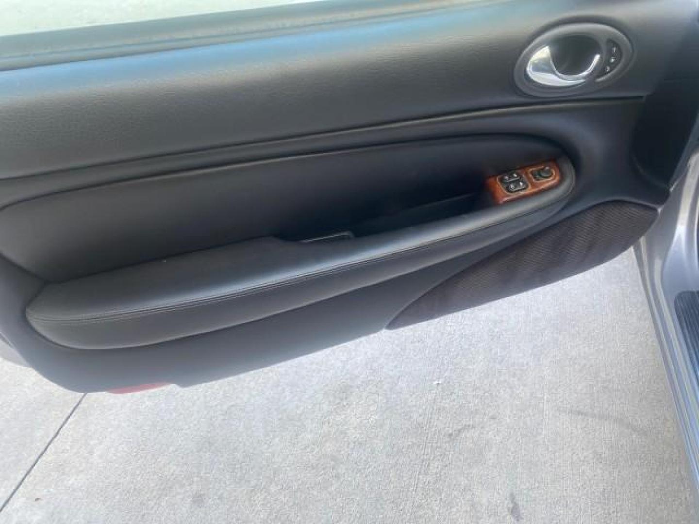 2004 Quartz /Charcoal Jaguar XK8 XK8 CONV LOW MILES 22,152 (SAJDA42CX42) with an 4.2L DOHC EFI 32-Valve Aluminum Alloy V8 Engine engine, Automatic transmission, located at 4701 North Dixie Hwy, Pompano Beach, FL, 33064, (954) 422-2889, 26.240938, -80.123474 - OUR WEBPAGE FLORIDACARS1.COM HAS OVER 100 PHOTOS AND FREE CARFAX LINK 2004 JAGUAR XK-SERIES XK8 $ 75,530 NEW VIN: SAJDA42CX42A37634 S A J D A 4 2 C X 4 2 A 3 7 6 3 4 CONVERTIBLE 4.2L V8 F DOHC GASOLINE REAR WHEEL DRIVE TOP WORKS GREAT! TIRES ARE LIKE NEW! Top Features Alloy Wheels Leather Seats Alpi - Photo#30