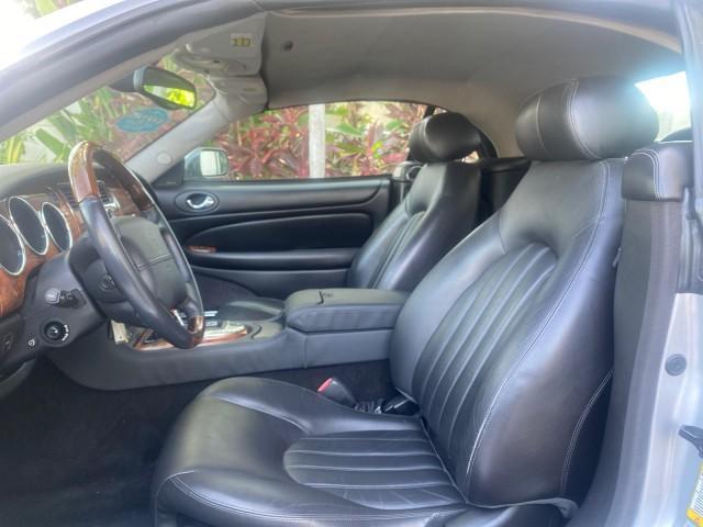 2004 Quartz /Charcoal Jaguar XK8 CONV LOW MILES 22,152 (SAJDA42CX42) with an 4.2L DOHC EFI 32-Valve Aluminum Alloy V8 Engine engine, Automatic transmission, located at 4701 North Dixie Hwy, Pompano Beach, FL, 33064, (954) 422-2889, 26.240938, -80.123474 - OUR WEBPAGE FLORIDACARS1.COM HAS OVER 100 PHOTOS AND FREE CARFAX LINK 2004 JAGUAR XK-SERIES XK8 $ 75,530 NEW VIN: SAJDA42CX42A37634 S A J D A 4 2 C X 4 2 A 3 7 6 3 4 CONVERTIBLE 4.2L V8 F DOHC GASOLINE REAR WHEEL DRIVE TOP WORKS GREAT! TIRES ARE LIKE NEW! Top Features Alloy Wheels Leather Seats Alpi - Photo#32