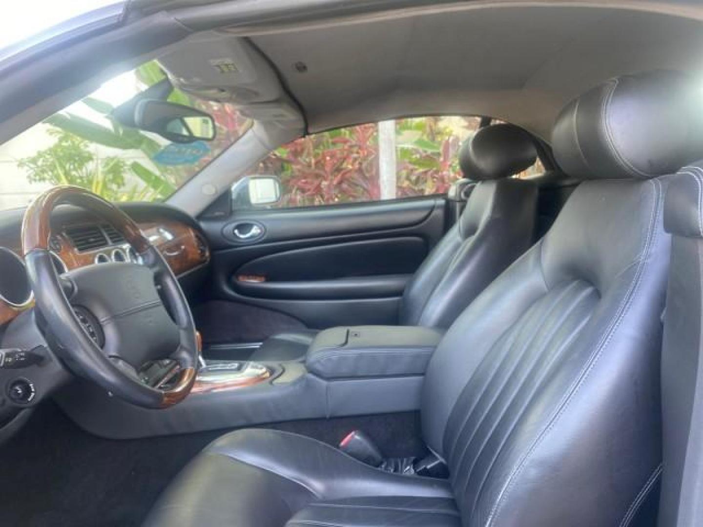 2004 Quartz /Charcoal Jaguar XK8 XK8 CONV LOW MILES 22,152 (SAJDA42CX42) with an 4.2L DOHC EFI 32-Valve Aluminum Alloy V8 Engine engine, Automatic transmission, located at 4701 North Dixie Hwy, Pompano Beach, FL, 33064, (954) 422-2889, 26.240938, -80.123474 - OUR WEBPAGE FLORIDACARS1.COM HAS OVER 100 PHOTOS AND FREE CARFAX LINK 2004 JAGUAR XK-SERIES XK8 $ 75,530 NEW VIN: SAJDA42CX42A37634 S A J D A 4 2 C X 4 2 A 3 7 6 3 4 CONVERTIBLE 4.2L V8 F DOHC GASOLINE REAR WHEEL DRIVE TOP WORKS GREAT! TIRES ARE LIKE NEW! Top Features Alloy Wheels Leather Seats Alpi - Photo#34