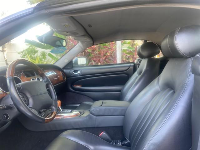 2004 Quartz /Charcoal Jaguar XK8 CONV LOW MILES 22,152 (SAJDA42CX42) with an 4.2L DOHC EFI 32-Valve Aluminum Alloy V8 Engine engine, Automatic transmission, located at 4701 North Dixie Hwy, Pompano Beach, FL, 33064, (954) 422-2889, 26.240938, -80.123474 - OUR WEBPAGE FLORIDACARS1.COM HAS OVER 100 PHOTOS AND FREE CARFAX LINK 2004 JAGUAR XK-SERIES XK8 $ 75,530 NEW VIN: SAJDA42CX42A37634 S A J D A 4 2 C X 4 2 A 3 7 6 3 4 CONVERTIBLE 4.2L V8 F DOHC GASOLINE REAR WHEEL DRIVE TOP WORKS GREAT! TIRES ARE LIKE NEW! Top Features Alloy Wheels Leather Seats Alpi - Photo#35
