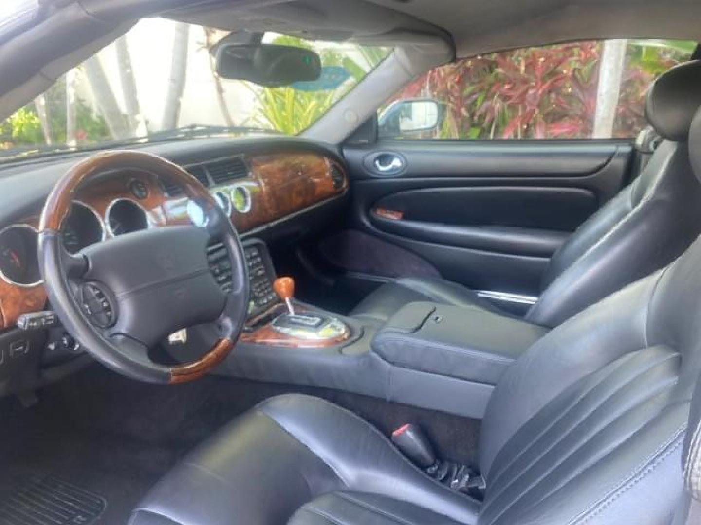 2004 Quartz /Charcoal Jaguar XK8 XK8 CONV LOW MILES 22,152 (SAJDA42CX42) with an 4.2L DOHC EFI 32-Valve Aluminum Alloy V8 Engine engine, Automatic transmission, located at 4701 North Dixie Hwy, Pompano Beach, FL, 33064, (954) 422-2889, 26.240938, -80.123474 - OUR WEBPAGE FLORIDACARS1.COM HAS OVER 100 PHOTOS AND FREE CARFAX LINK 2004 JAGUAR XK-SERIES XK8 $ 75,530 NEW VIN: SAJDA42CX42A37634 S A J D A 4 2 C X 4 2 A 3 7 6 3 4 CONVERTIBLE 4.2L V8 F DOHC GASOLINE REAR WHEEL DRIVE TOP WORKS GREAT! TIRES ARE LIKE NEW! Top Features Alloy Wheels Leather Seats Alpi - Photo#36