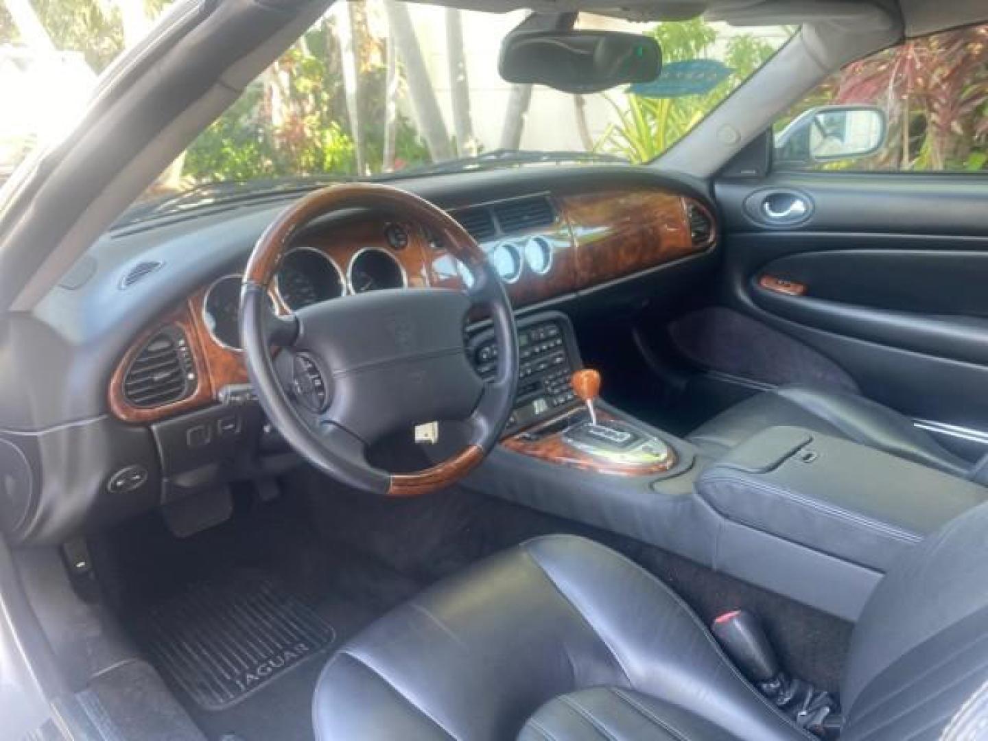 2004 Quartz /Charcoal Jaguar XK8 XK8 CONV LOW MILES 22,152 (SAJDA42CX42) with an 4.2L DOHC EFI 32-Valve Aluminum Alloy V8 Engine engine, Automatic transmission, located at 4701 North Dixie Hwy, Pompano Beach, FL, 33064, (954) 422-2889, 26.240938, -80.123474 - OUR WEBPAGE FLORIDACARS1.COM HAS OVER 100 PHOTOS AND FREE CARFAX LINK 2004 JAGUAR XK-SERIES XK8 $ 75,530 NEW VIN: SAJDA42CX42A37634 S A J D A 4 2 C X 4 2 A 3 7 6 3 4 CONVERTIBLE 4.2L V8 F DOHC GASOLINE REAR WHEEL DRIVE TOP WORKS GREAT! TIRES ARE LIKE NEW! Top Features Alloy Wheels Leather Seats Alpi - Photo#38
