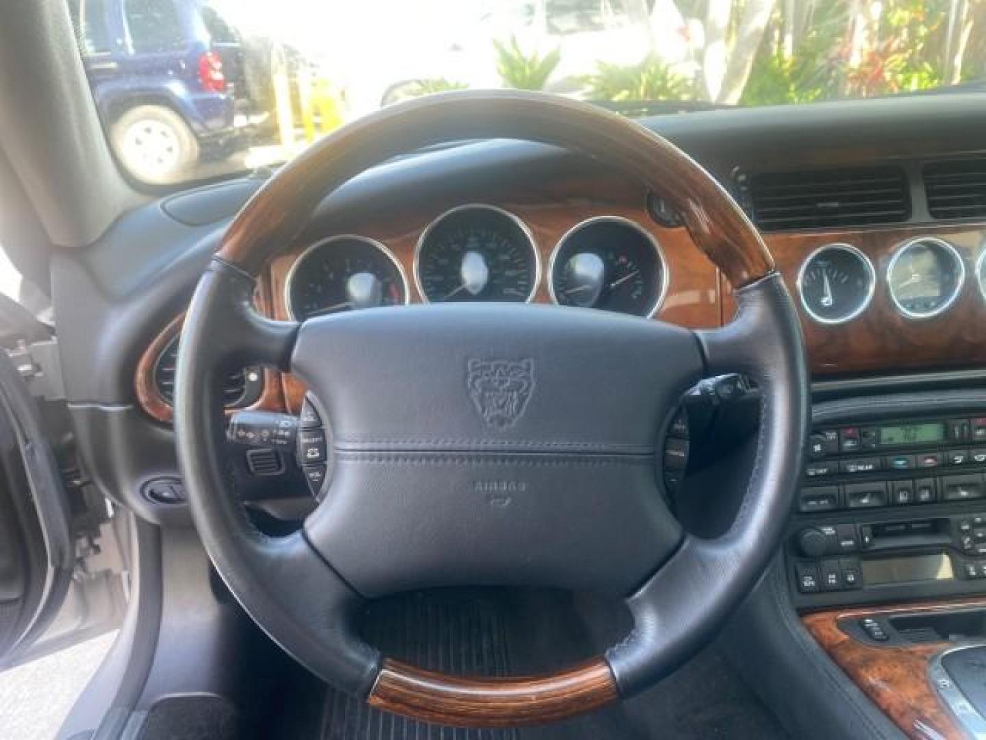 2004 Quartz /Charcoal Jaguar XK8 XK8 CONV LOW MILES 22,152 (SAJDA42CX42) with an 4.2L DOHC EFI 32-Valve Aluminum Alloy V8 Engine engine, Automatic transmission, located at 4701 North Dixie Hwy, Pompano Beach, FL, 33064, (954) 422-2889, 26.240938, -80.123474 - OUR WEBPAGE FLORIDACARS1.COM HAS OVER 100 PHOTOS AND FREE CARFAX LINK 2004 JAGUAR XK-SERIES XK8 $ 75,530 NEW VIN: SAJDA42CX42A37634 S A J D A 4 2 C X 4 2 A 3 7 6 3 4 CONVERTIBLE 4.2L V8 F DOHC GASOLINE REAR WHEEL DRIVE TOP WORKS GREAT! TIRES ARE LIKE NEW! Top Features Alloy Wheels Leather Seats Alpi - Photo#39