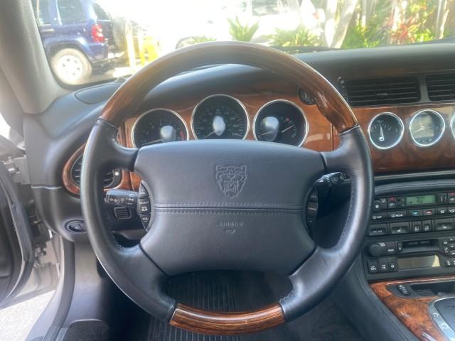 2004 Quartz /Charcoal Jaguar XK8 CONV LOW MILES 22,152 (SAJDA42CX42) with an 4.2L DOHC EFI 32-Valve Aluminum Alloy V8 Engine engine, Automatic transmission, located at 4701 North Dixie Hwy, Pompano Beach, FL, 33064, (954) 422-2889, 26.240938, -80.123474 - OUR WEBPAGE FLORIDACARS1.COM HAS OVER 100 PHOTOS AND FREE CARFAX LINK 2004 JAGUAR XK-SERIES XK8 $ 75,530 NEW VIN: SAJDA42CX42A37634 S A J D A 4 2 C X 4 2 A 3 7 6 3 4 CONVERTIBLE 4.2L V8 F DOHC GASOLINE REAR WHEEL DRIVE TOP WORKS GREAT! TIRES ARE LIKE NEW! Top Features Alloy Wheels Leather Seats Alpi - Photo#39