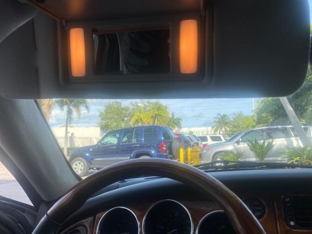 2004 Quartz /Charcoal Jaguar XK8 CONV LOW MILES 22,152 (SAJDA42CX42) with an 4.2L DOHC EFI 32-Valve Aluminum Alloy V8 Engine engine, Automatic transmission, located at 4701 North Dixie Hwy, Pompano Beach, FL, 33064, (954) 422-2889, 26.240938, -80.123474 - OUR WEBPAGE FLORIDACARS1.COM HAS OVER 100 PHOTOS AND FREE CARFAX LINK 2004 JAGUAR XK-SERIES XK8 $ 75,530 NEW VIN: SAJDA42CX42A37634 S A J D A 4 2 C X 4 2 A 3 7 6 3 4 CONVERTIBLE 4.2L V8 F DOHC GASOLINE REAR WHEEL DRIVE TOP WORKS GREAT! TIRES ARE LIKE NEW! Top Features Alloy Wheels Leather Seats Alpi - Photo#56
