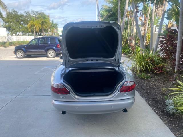 2004 Quartz /Charcoal Jaguar XK8 CONV LOW MILES 22,152 (SAJDA42CX42) with an 4.2L DOHC EFI 32-Valve Aluminum Alloy V8 Engine engine, Automatic transmission, located at 4701 North Dixie Hwy, Pompano Beach, FL, 33064, (954) 422-2889, 26.240938, -80.123474 - OUR WEBPAGE FLORIDACARS1.COM HAS OVER 100 PHOTOS AND FREE CARFAX LINK 2004 JAGUAR XK-SERIES XK8 $ 75,530 NEW VIN: SAJDA42CX42A37634 S A J D A 4 2 C X 4 2 A 3 7 6 3 4 CONVERTIBLE 4.2L V8 F DOHC GASOLINE REAR WHEEL DRIVE TOP WORKS GREAT! TIRES ARE LIKE NEW! Top Features Alloy Wheels Leather Seats Alpi - Photo#69