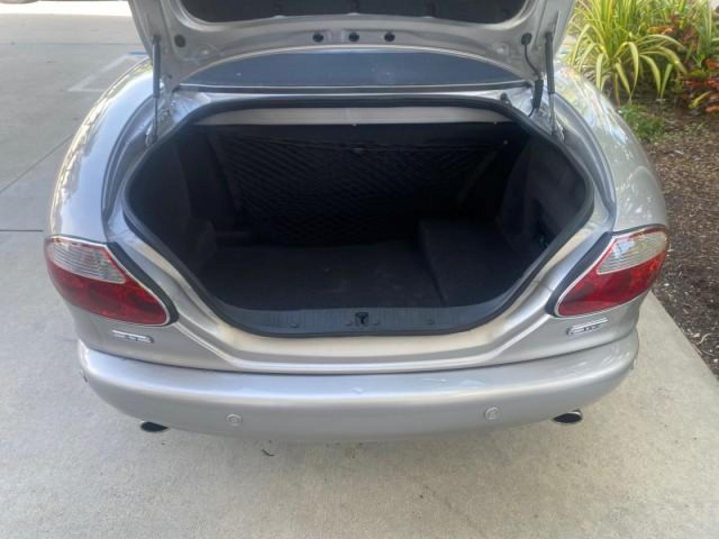 2004 Quartz /Charcoal Jaguar XK8 XK8 CONV LOW MILES 22,152 (SAJDA42CX42) with an 4.2L DOHC EFI 32-Valve Aluminum Alloy V8 Engine engine, Automatic transmission, located at 4701 North Dixie Hwy, Pompano Beach, FL, 33064, (954) 422-2889, 26.240938, -80.123474 - OUR WEBPAGE FLORIDACARS1.COM HAS OVER 100 PHOTOS AND FREE CARFAX LINK 2004 JAGUAR XK-SERIES XK8 $ 75,530 NEW VIN: SAJDA42CX42A37634 S A J D A 4 2 C X 4 2 A 3 7 6 3 4 CONVERTIBLE 4.2L V8 F DOHC GASOLINE REAR WHEEL DRIVE TOP WORKS GREAT! TIRES ARE LIKE NEW! Top Features Alloy Wheels Leather Seats Alpi - Photo#70