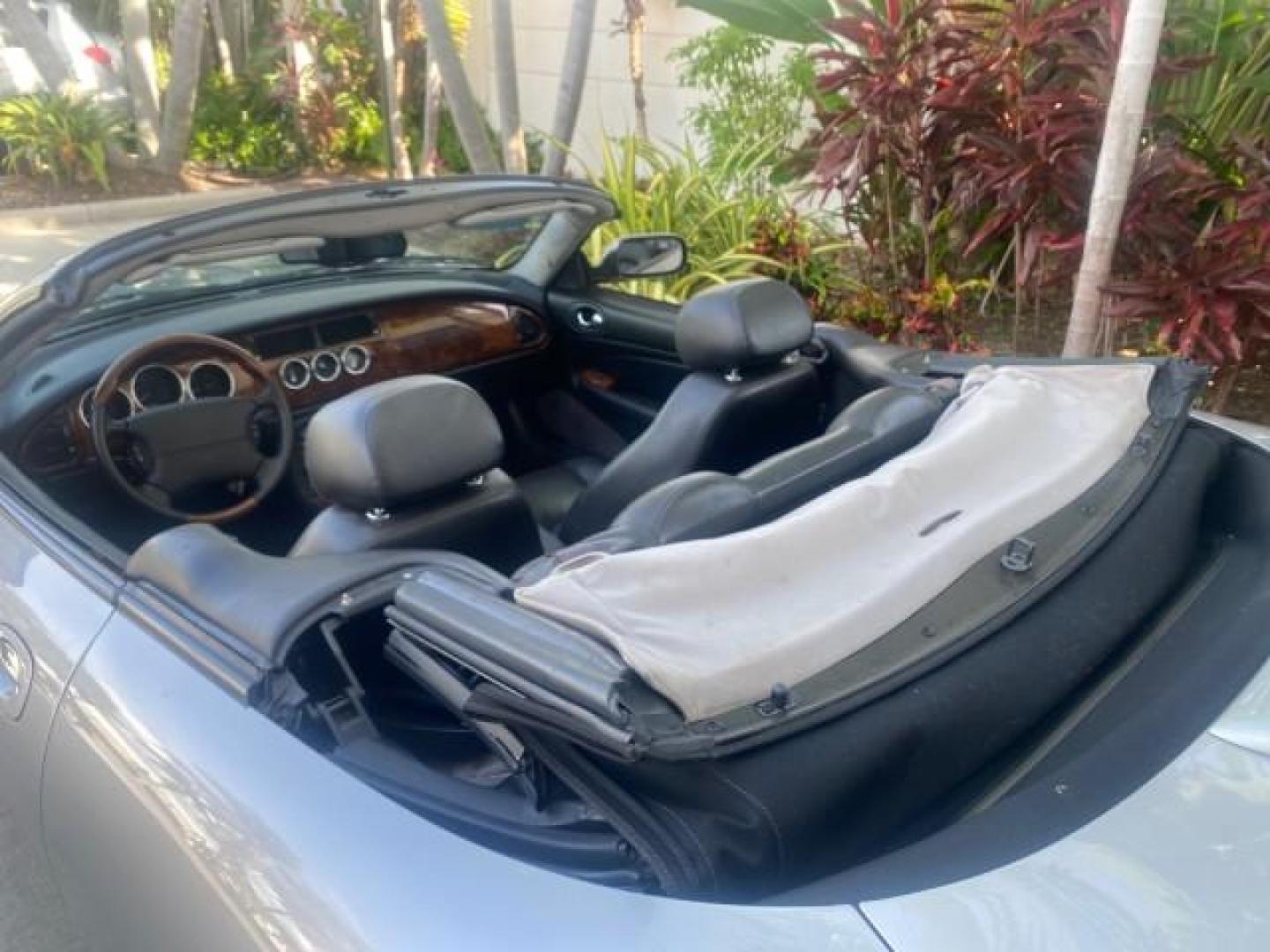 2004 Quartz /Charcoal Jaguar XK8 XK8 CONV LOW MILES 22,152 (SAJDA42CX42) with an 4.2L DOHC EFI 32-Valve Aluminum Alloy V8 Engine engine, Automatic transmission, located at 4701 North Dixie Hwy, Pompano Beach, FL, 33064, (954) 422-2889, 26.240938, -80.123474 - OUR WEBPAGE FLORIDACARS1.COM HAS OVER 100 PHOTOS AND FREE CARFAX LINK 2004 JAGUAR XK-SERIES XK8 $ 75,530 NEW VIN: SAJDA42CX42A37634 S A J D A 4 2 C X 4 2 A 3 7 6 3 4 CONVERTIBLE 4.2L V8 F DOHC GASOLINE REAR WHEEL DRIVE TOP WORKS GREAT! TIRES ARE LIKE NEW! Top Features Alloy Wheels Leather Seats Alpi - Photo#90