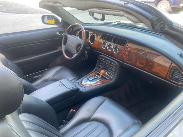 2004 Quartz /Charcoal Jaguar XK8 CONV LOW MILES 22,152 (SAJDA42CX42) with an 4.2L DOHC EFI 32-Valve Aluminum Alloy V8 Engine engine, Automatic transmission, located at 4701 North Dixie Hwy, Pompano Beach, FL, 33064, (954) 422-2889, 26.240938, -80.123474 - OUR WEBPAGE FLORIDACARS1.COM HAS OVER 100 PHOTOS AND FREE CARFAX LINK 2004 JAGUAR XK-SERIES XK8 $ 75,530 NEW VIN: SAJDA42CX42A37634 S A J D A 4 2 C X 4 2 A 3 7 6 3 4 CONVERTIBLE 4.2L V8 F DOHC GASOLINE REAR WHEEL DRIVE TOP WORKS GREAT! TIRES ARE LIKE NEW! Top Features Alloy Wheels Leather Seats Alpi - Photo#95