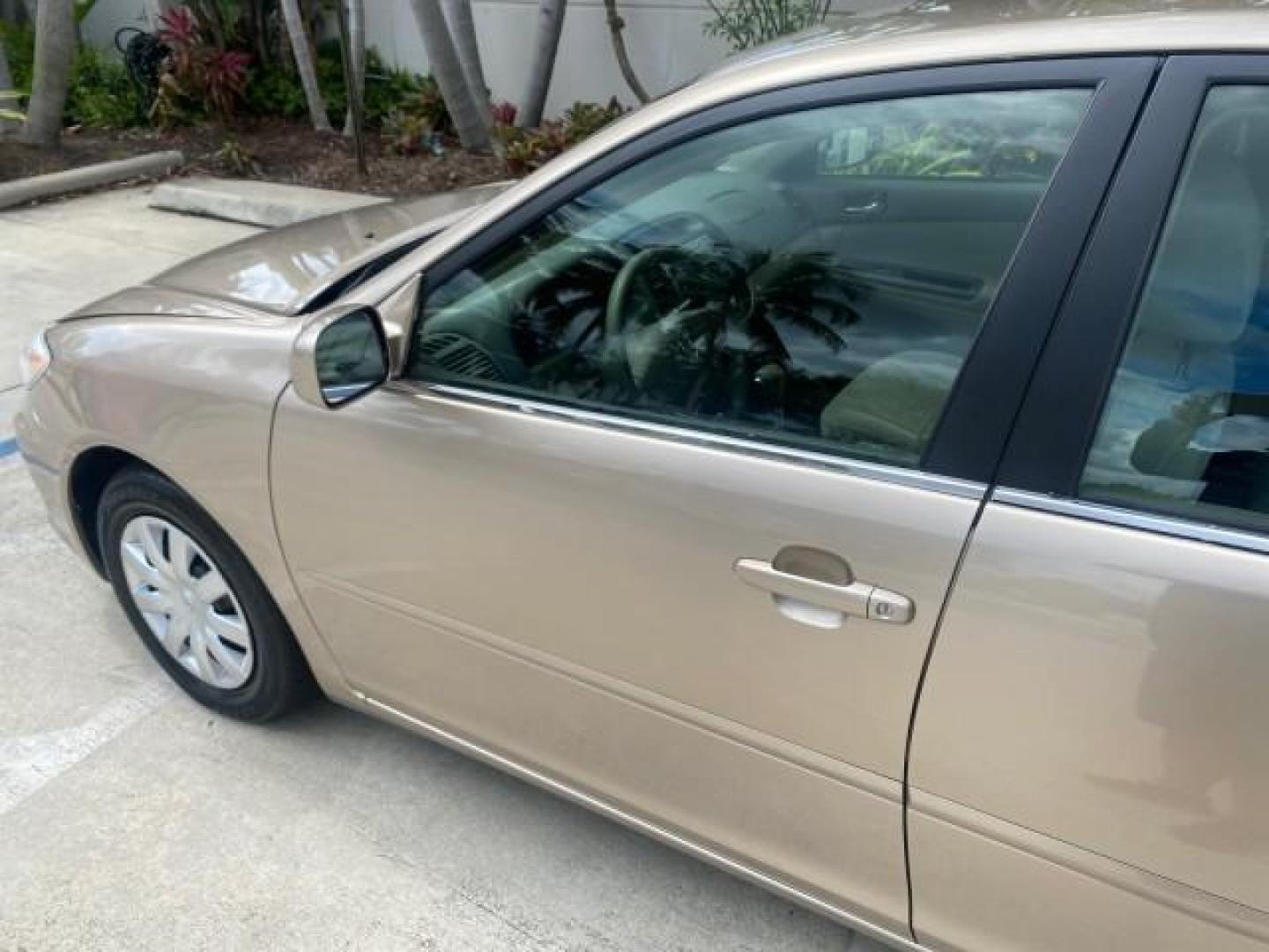 2005 Desert Sand Mica /Stone Toyota Camry LE LOW MILES 57,170 1 FLORIDA (4T1BE32KX5U) with an 2.4L DOHC SEFI Vvti 16-Valve 4-Cyl Engine engine, Automatic transmission, located at 4701 North Dixie Hwy, Pompano Beach, FL, 33064, (954) 422-2889, 26.240938, -80.123474 - OUR WEBPAGE FLORIDACARS1.COM HAS OVER 100 PHOTOS AND FREE CARFAX LINK 2005 TOYOTA CAMRY LE AUTO AC VIN: 4T1BE32KX5U991049 4 T 1 B E 3 2 K X 5 U 9 9 1 0 4 9 SEDAN 4 DR 2.4L I4 F DOHC 16V 34 MPG GASOLINE FRONT WHEEL DRIVE Top Features Cloth Seats Basic Features ABS Brakes Automatic Transmission Power - Photo#27