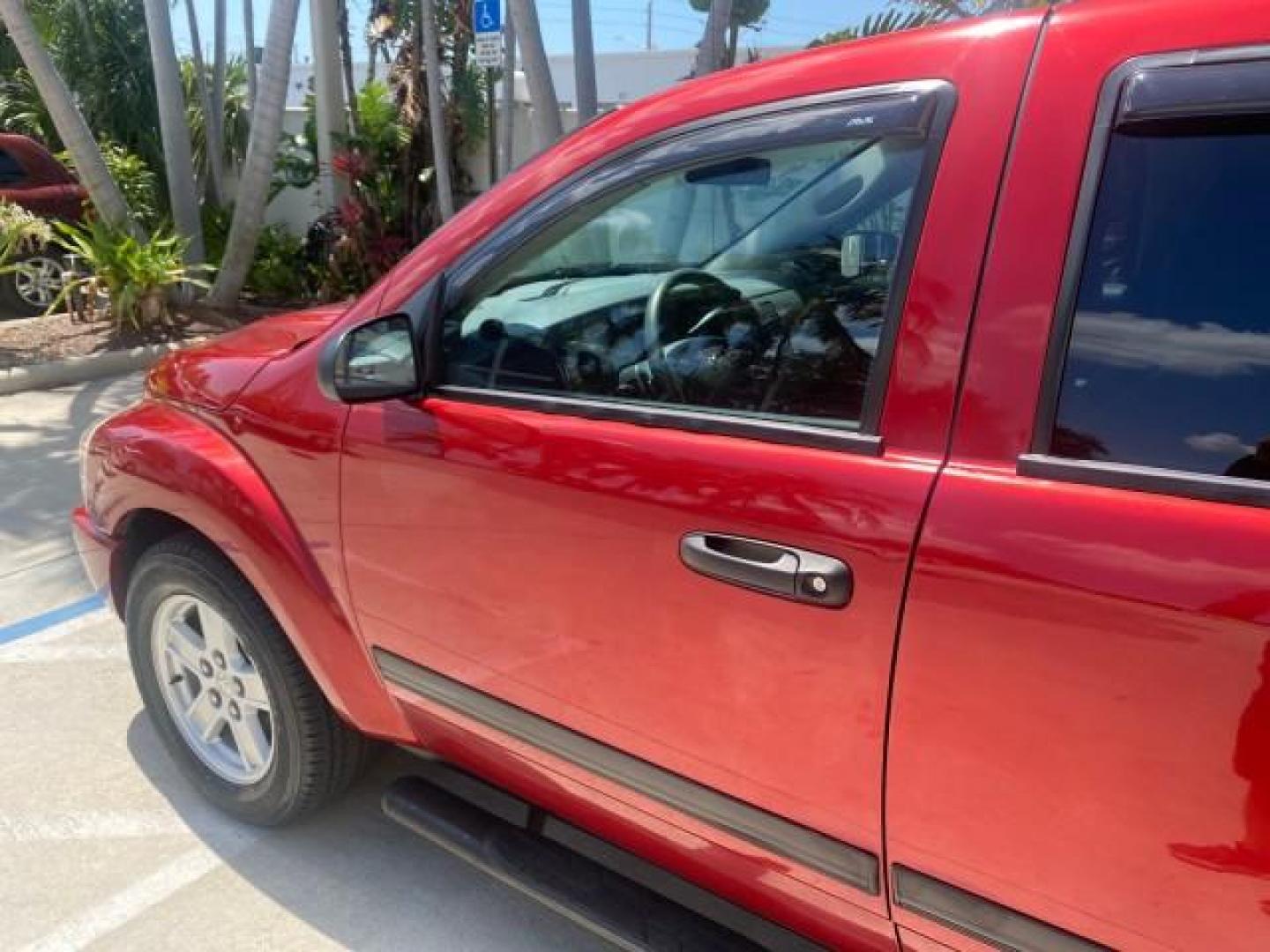 2006 Flame Red /Med Slate Gray Dodge Durango 3RD ROW SLT LOW MILES 34,957 (1D4HD48N06F) with an 4.7L V8 Magnum Engine engine, Automatic transmission, located at 4701 North Dixie Hwy, Pompano Beach, FL, 33064, (954) 422-2889, 26.240938, -80.123474 - OUR WEBPAGE FLORIDACARS1.COM HAS OVER 100 PHOTOS AND FREE CARFAX LINK 2006 DODGE DURANGO SLT 50 SERVICE RECORDS FULLY MAINTANED VIN: 1D4HD48N06F182662 1 D 4 H D 4 8 N 0 6 F 1 8 2 6 6 2 4 DOOR WAGON/SPORT UTILITY 4.7L V8 F OHV GASOLINE REAR WHEEL DRIVE Top Features Alloy Wheels Rear Entertainment Sys - Photo#27
