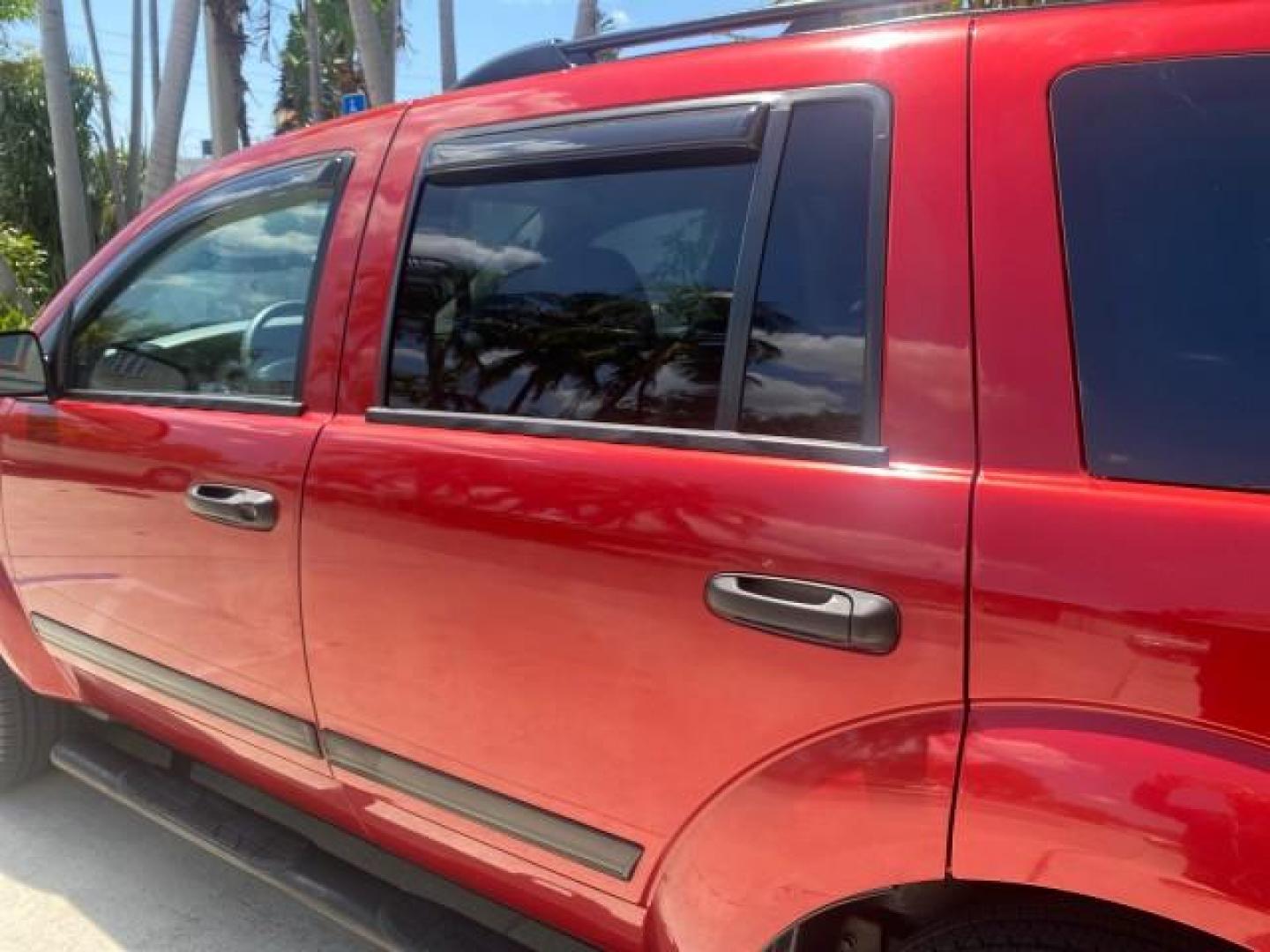 2006 Flame Red /Med Slate Gray Dodge Durango 3RD ROW SLT LOW MILES 34,957 (1D4HD48N06F) with an 4.7L V8 Magnum Engine engine, Automatic transmission, located at 4701 North Dixie Hwy, Pompano Beach, FL, 33064, (954) 422-2889, 26.240938, -80.123474 - OUR WEBPAGE FLORIDACARS1.COM HAS OVER 100 PHOTOS AND FREE CARFAX LINK 2006 DODGE DURANGO SLT 50 SERVICE RECORDS FULLY MAINTANED VIN: 1D4HD48N06F182662 1 D 4 H D 4 8 N 0 6 F 1 8 2 6 6 2 4 DOOR WAGON/SPORT UTILITY 4.7L V8 F OHV GASOLINE REAR WHEEL DRIVE Top Features Alloy Wheels Rear Entertainment Sys - Photo#60