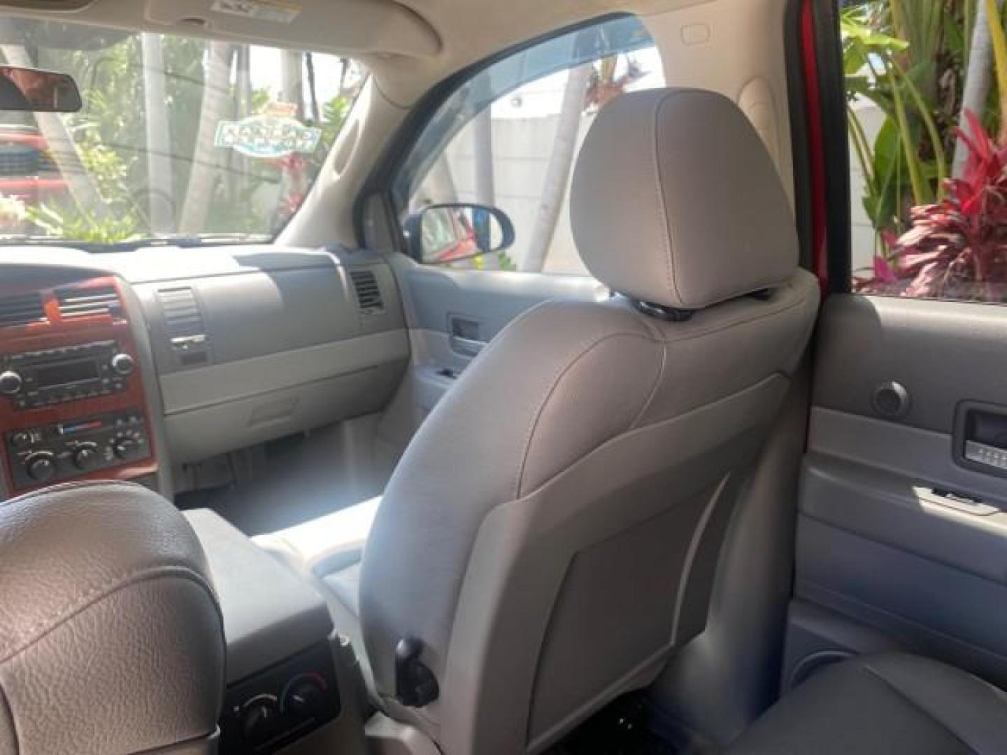 2006 Flame Red /Med Slate Gray Dodge Durango 3RD ROW SLT LOW MILES 34,957 (1D4HD48N06F) with an 4.7L V8 Magnum Engine engine, Automatic transmission, located at 4701 North Dixie Hwy, Pompano Beach, FL, 33064, (954) 422-2889, 26.240938, -80.123474 - OUR WEBPAGE FLORIDACARS1.COM HAS OVER 100 PHOTOS AND FREE CARFAX LINK 2006 DODGE DURANGO SLT 50 SERVICE RECORDS FULLY MAINTANED VIN: 1D4HD48N06F182662 1 D 4 H D 4 8 N 0 6 F 1 8 2 6 6 2 4 DOOR WAGON/SPORT UTILITY 4.7L V8 F OHV GASOLINE REAR WHEEL DRIVE Top Features Alloy Wheels Rear Entertainment Sys - Photo#72