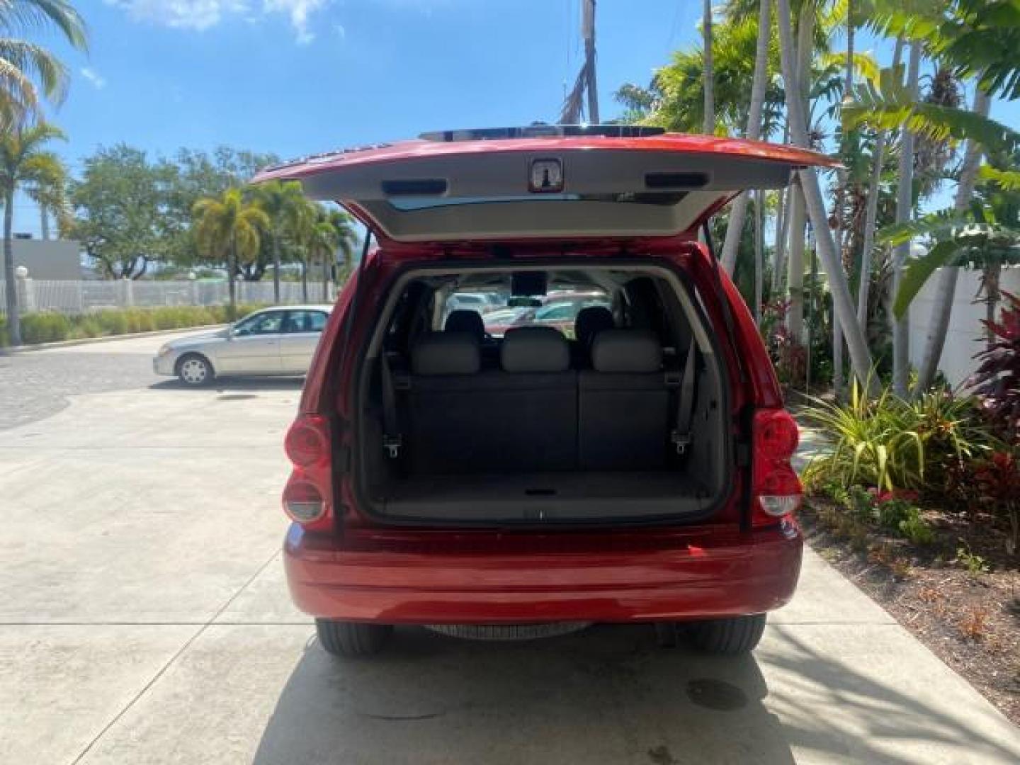 2006 Flame Red /Med Slate Gray Dodge Durango 3RD ROW SLT LOW MILES 34,957 (1D4HD48N06F) with an 4.7L V8 Magnum Engine engine, Automatic transmission, located at 4701 North Dixie Hwy, Pompano Beach, FL, 33064, (954) 422-2889, 26.240938, -80.123474 - OUR WEBPAGE FLORIDACARS1.COM HAS OVER 100 PHOTOS AND FREE CARFAX LINK 2006 DODGE DURANGO SLT 50 SERVICE RECORDS FULLY MAINTANED VIN: 1D4HD48N06F182662 1 D 4 H D 4 8 N 0 6 F 1 8 2 6 6 2 4 DOOR WAGON/SPORT UTILITY 4.7L V8 F OHV GASOLINE REAR WHEEL DRIVE Top Features Alloy Wheels Rear Entertainment Sys - Photo#83