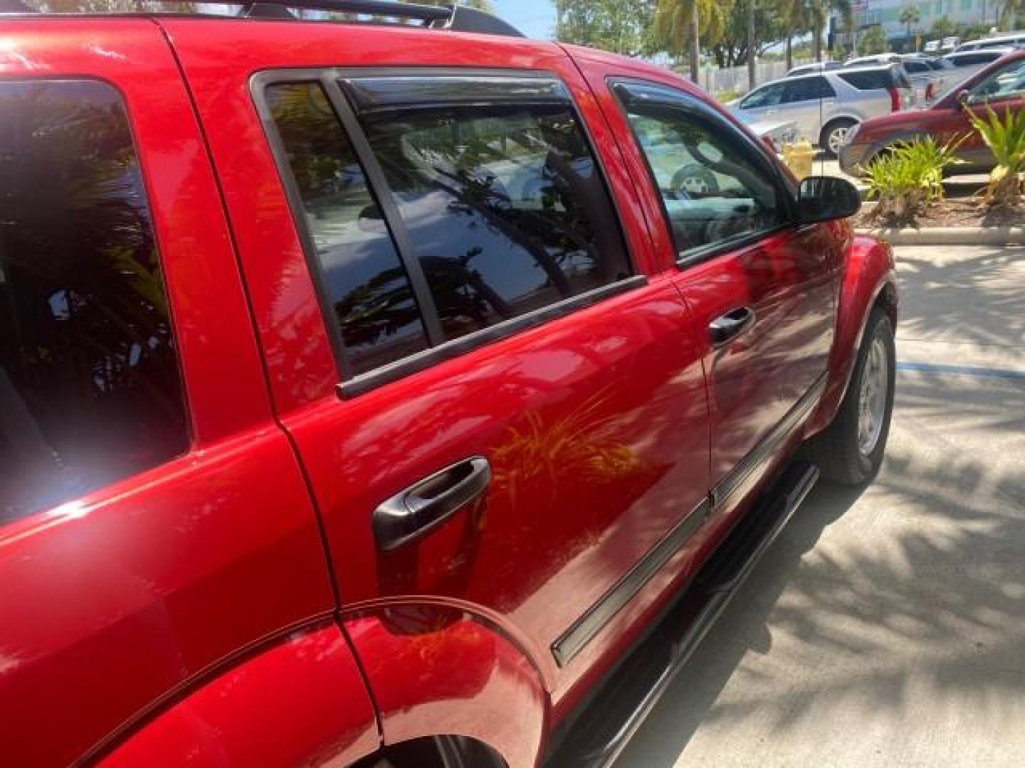 2006 Flame Red /Med Slate Gray Dodge Durango 3RD ROW SLT LOW MILES 34,957 (1D4HD48N06F) with an 4.7L V8 Magnum Engine engine, Automatic transmission, located at 4701 North Dixie Hwy, Pompano Beach, FL, 33064, (954) 422-2889, 26.240938, -80.123474 - OUR WEBPAGE FLORIDACARS1.COM HAS OVER 100 PHOTOS AND FREE CARFAX LINK 2006 DODGE DURANGO SLT 50 SERVICE RECORDS FULLY MAINTANED VIN: 1D4HD48N06F182662 1 D 4 H D 4 8 N 0 6 F 1 8 2 6 6 2 4 DOOR WAGON/SPORT UTILITY 4.7L V8 F OHV GASOLINE REAR WHEEL DRIVE Top Features Alloy Wheels Rear Entertainment Sys - Photo#89