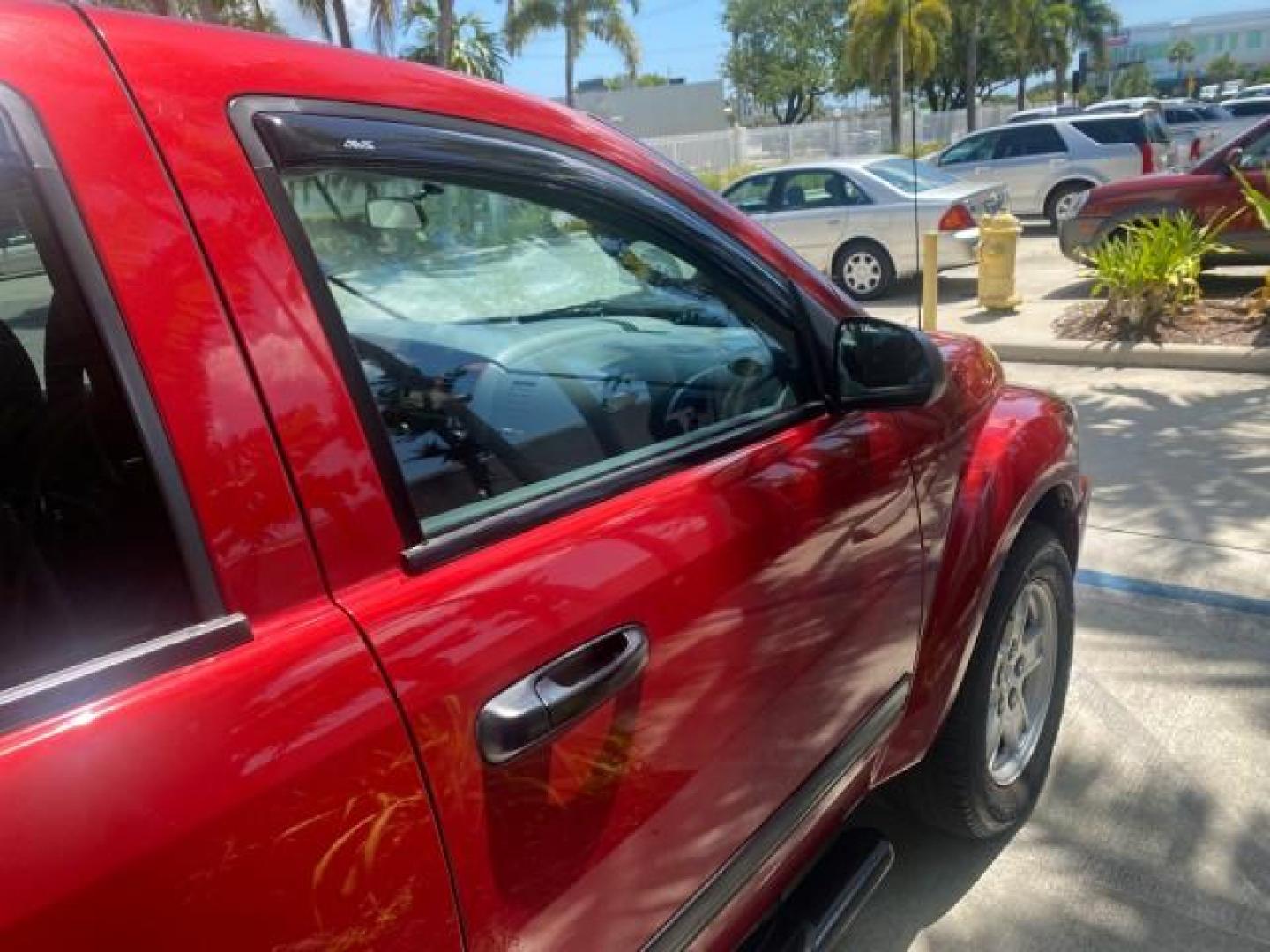 2006 Flame Red /Med Slate Gray Dodge Durango 3RD ROW SLT LOW MILES 34,957 (1D4HD48N06F) with an 4.7L V8 Magnum Engine engine, Automatic transmission, located at 4701 North Dixie Hwy, Pompano Beach, FL, 33064, (954) 422-2889, 26.240938, -80.123474 - OUR WEBPAGE FLORIDACARS1.COM HAS OVER 100 PHOTOS AND FREE CARFAX LINK 2006 DODGE DURANGO SLT 50 SERVICE RECORDS FULLY MAINTANED VIN: 1D4HD48N06F182662 1 D 4 H D 4 8 N 0 6 F 1 8 2 6 6 2 4 DOOR WAGON/SPORT UTILITY 4.7L V8 F OHV GASOLINE REAR WHEEL DRIVE Top Features Alloy Wheels Rear Entertainment Sys - Photo#99