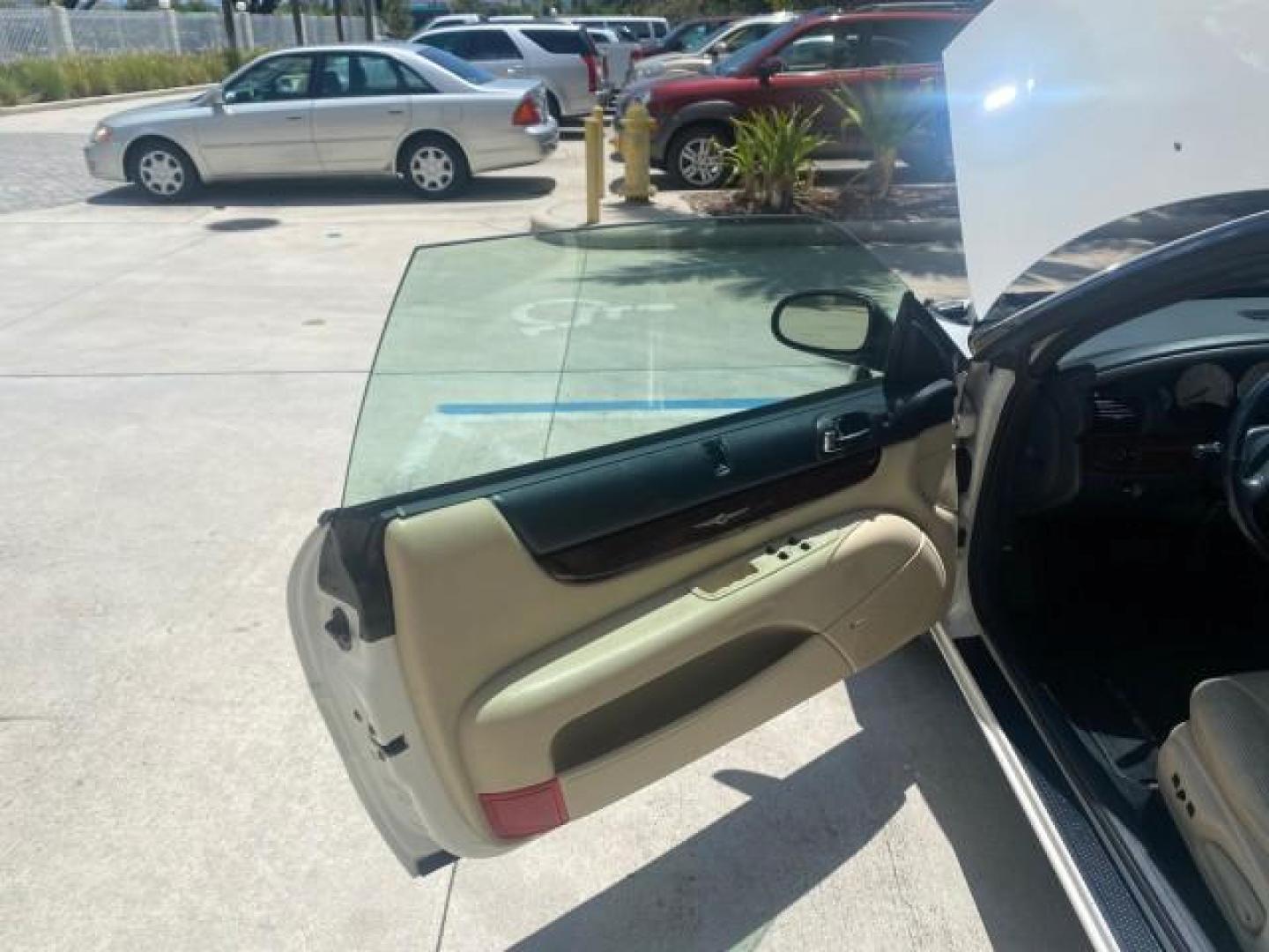 2002 Stone White /Royal Blue/Cream Chrysler Sebring Limited FL LOW MILES 34,440 (1C3EL65R52N) with an 2.7L MFI DOHC 24-Valve V6 Engine engine, Automatic transmission, located at 4701 North Dixie Hwy, Pompano Beach, FL, 33064, (954) 422-2889, 26.240938, -80.123474 - OUR WEBPAGE FLORIDACARS1.COM HAS OVER 100 PHOTOS AND FREE CARFAX LINK 2002 CHRYSLER SEBRING LIMITED VIN: 1C3EL65R52N169318 1 C 3 E L 6 5 R 5 2 N 1 6 9 3 1 8 CONVERTIBLE 2.7L V6 F DOHC GASOLINE FRONT WHEEL DRIVE Top Features Alloy Wheels Soft Top Infinity Sound System Sunroof(s) Leather Seats Basic F - Photo#9