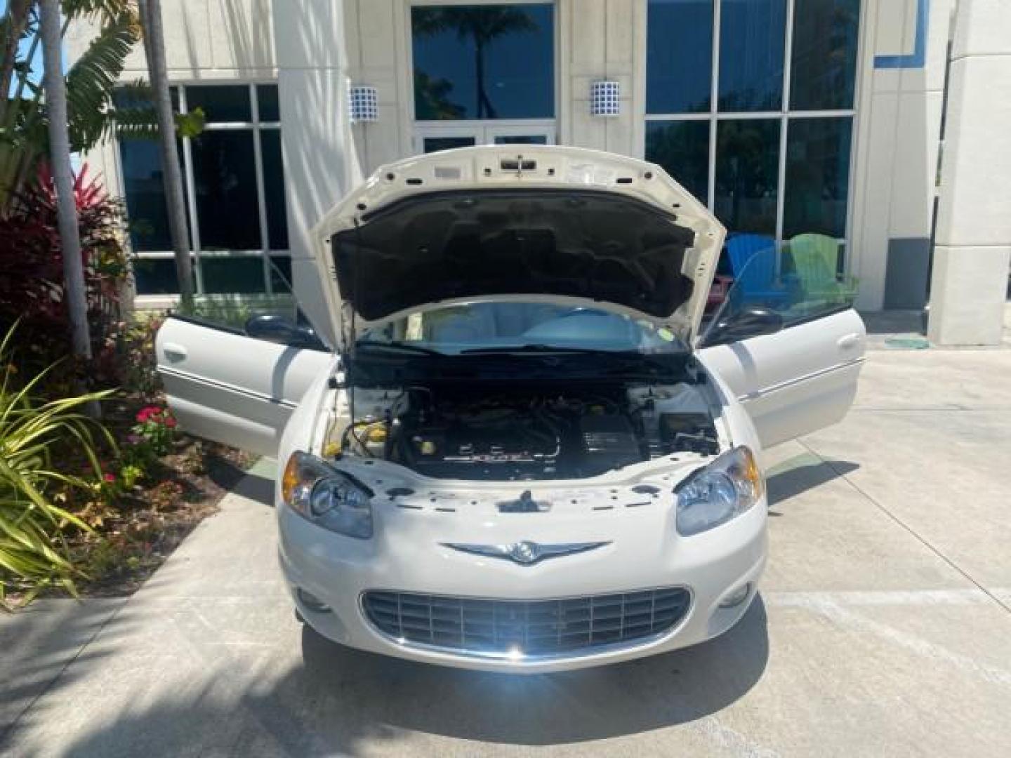 2002 Stone White /Royal Blue/Cream Chrysler Sebring Limited FL LOW MILES 34,440 (1C3EL65R52N) with an 2.7L MFI DOHC 24-Valve V6 Engine engine, Automatic transmission, located at 4701 North Dixie Hwy, Pompano Beach, FL, 33064, (954) 422-2889, 26.240938, -80.123474 - OUR WEBPAGE FLORIDACARS1.COM HAS OVER 100 PHOTOS AND FREE CARFAX LINK 2002 CHRYSLER SEBRING LIMITED VIN: 1C3EL65R52N169318 1 C 3 E L 6 5 R 5 2 N 1 6 9 3 1 8 CONVERTIBLE 2.7L V6 F DOHC GASOLINE FRONT WHEEL DRIVE Top Features Alloy Wheels Soft Top Infinity Sound System Sunroof(s) Leather Seats Basic F - Photo#16