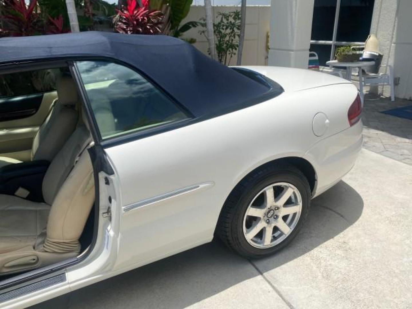 2002 Stone White /Royal Blue/Cream Chrysler Sebring Limited FL LOW MILES 34,440 (1C3EL65R52N) with an 2.7L MFI DOHC 24-Valve V6 Engine engine, Automatic transmission, located at 4701 North Dixie Hwy, Pompano Beach, FL, 33064, (954) 422-2889, 26.240938, -80.123474 - OUR WEBPAGE FLORIDACARS1.COM HAS OVER 100 PHOTOS AND FREE CARFAX LINK 2002 CHRYSLER SEBRING LIMITED VIN: 1C3EL65R52N169318 1 C 3 E L 6 5 R 5 2 N 1 6 9 3 1 8 CONVERTIBLE 2.7L V6 F DOHC GASOLINE FRONT WHEEL DRIVE Top Features Alloy Wheels Soft Top Infinity Sound System Sunroof(s) Leather Seats Basic F - Photo#13