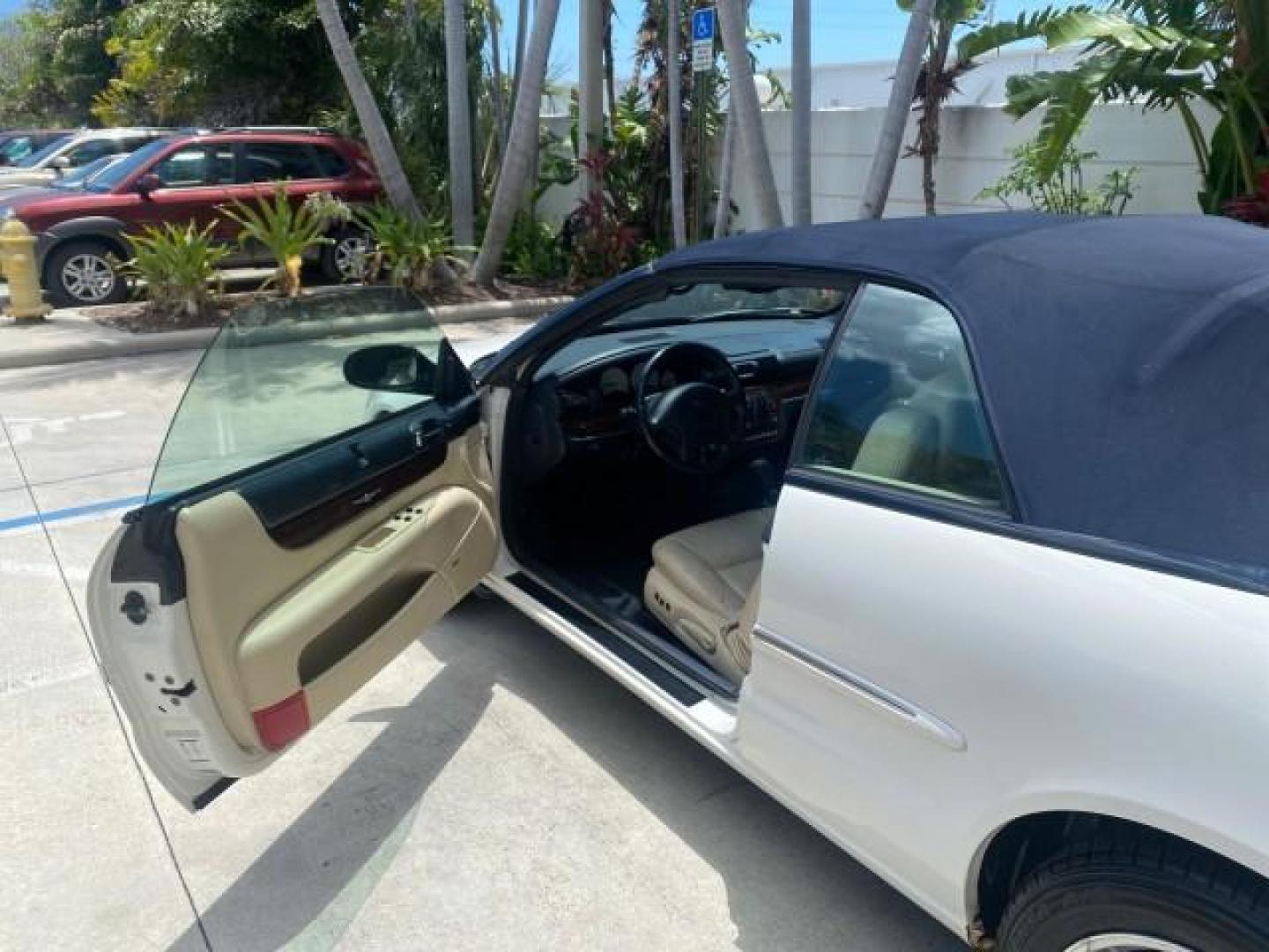 2002 Stone White /Royal Blue/Cream Chrysler Sebring Limited FL LOW MILES 34,440 (1C3EL65R52N) with an 2.7L MFI DOHC 24-Valve V6 Engine engine, Automatic transmission, located at 4701 North Dixie Hwy, Pompano Beach, FL, 33064, (954) 422-2889, 26.240938, -80.123474 - OUR WEBPAGE FLORIDACARS1.COM HAS OVER 100 PHOTOS AND FREE CARFAX LINK 2002 CHRYSLER SEBRING LIMITED VIN: 1C3EL65R52N169318 1 C 3 E L 6 5 R 5 2 N 1 6 9 3 1 8 CONVERTIBLE 2.7L V6 F DOHC GASOLINE FRONT WHEEL DRIVE Top Features Alloy Wheels Soft Top Infinity Sound System Sunroof(s) Leather Seats Basic F - Photo#63