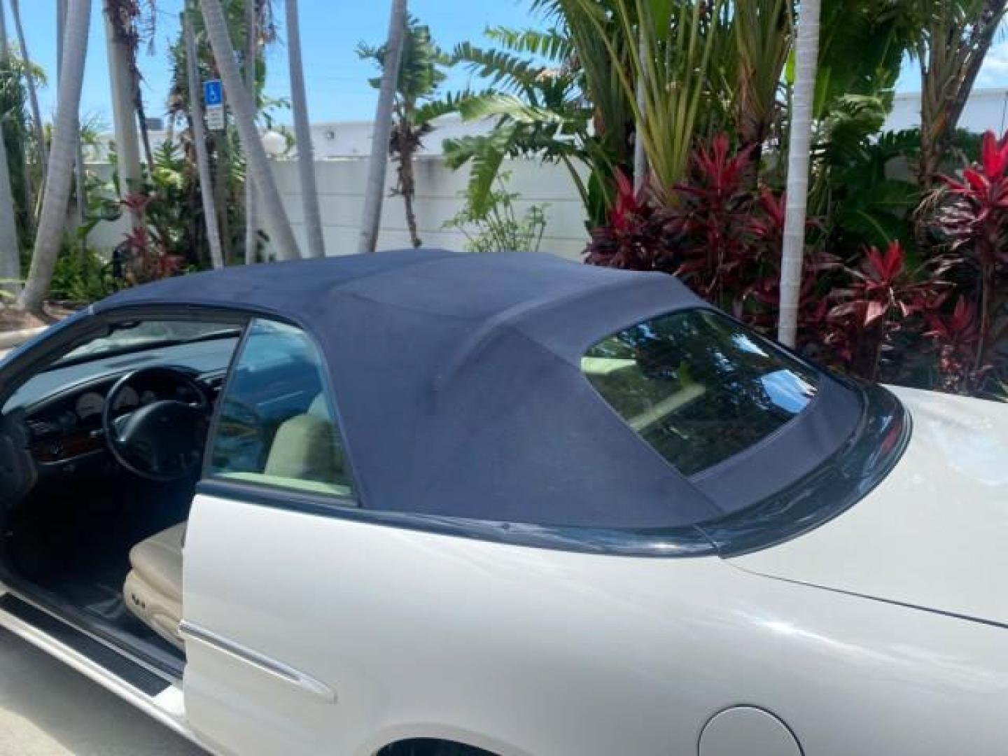 2002 Stone White /Royal Blue/Cream Chrysler Sebring Limited FL LOW MILES 34,440 (1C3EL65R52N) with an 2.7L MFI DOHC 24-Valve V6 Engine engine, Automatic transmission, located at 4701 North Dixie Hwy, Pompano Beach, FL, 33064, (954) 422-2889, 26.240938, -80.123474 - OUR WEBPAGE FLORIDACARS1.COM HAS OVER 100 PHOTOS AND FREE CARFAX LINK 2002 CHRYSLER SEBRING LIMITED VIN: 1C3EL65R52N169318 1 C 3 E L 6 5 R 5 2 N 1 6 9 3 1 8 CONVERTIBLE 2.7L V6 F DOHC GASOLINE FRONT WHEEL DRIVE Top Features Alloy Wheels Soft Top Infinity Sound System Sunroof(s) Leather Seats Basic F - Photo#64