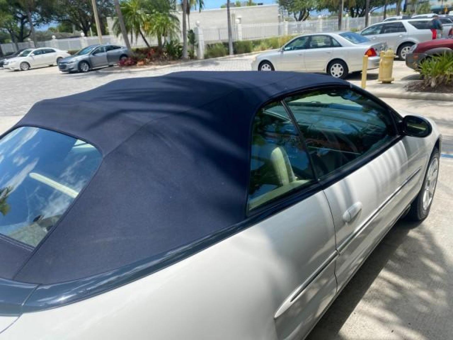 2002 Stone White /Royal Blue/Cream Chrysler Sebring Limited FL LOW MILES 34,440 (1C3EL65R52N) with an 2.7L MFI DOHC 24-Valve V6 Engine engine, Automatic transmission, located at 4701 North Dixie Hwy, Pompano Beach, FL, 33064, (954) 422-2889, 26.240938, -80.123474 - OUR WEBPAGE FLORIDACARS1.COM HAS OVER 100 PHOTOS AND FREE CARFAX LINK 2002 CHRYSLER SEBRING LIMITED VIN: 1C3EL65R52N169318 1 C 3 E L 6 5 R 5 2 N 1 6 9 3 1 8 CONVERTIBLE 2.7L V6 F DOHC GASOLINE FRONT WHEEL DRIVE Top Features Alloy Wheels Soft Top Infinity Sound System Sunroof(s) Leather Seats Basic F - Photo#81