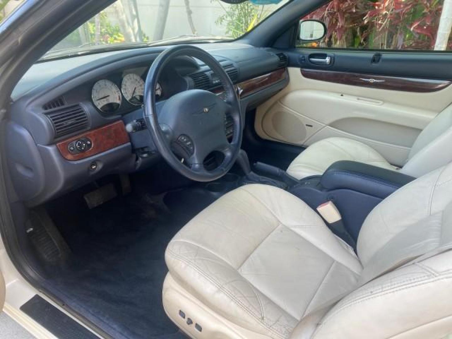 2002 Stone White /Royal Blue/Cream Chrysler Sebring Limited FL LOW MILES 34,440 (1C3EL65R52N) with an 2.7L MFI DOHC 24-Valve V6 Engine engine, Automatic transmission, located at 4701 North Dixie Hwy, Pompano Beach, FL, 33064, (954) 422-2889, 26.240938, -80.123474 - OUR WEBPAGE FLORIDACARS1.COM HAS OVER 100 PHOTOS AND FREE CARFAX LINK 2002 CHRYSLER SEBRING LIMITED VIN: 1C3EL65R52N169318 1 C 3 E L 6 5 R 5 2 N 1 6 9 3 1 8 CONVERTIBLE 2.7L V6 F DOHC GASOLINE FRONT WHEEL DRIVE Top Features Alloy Wheels Soft Top Infinity Sound System Sunroof(s) Leather Seats Basic F - Photo#35