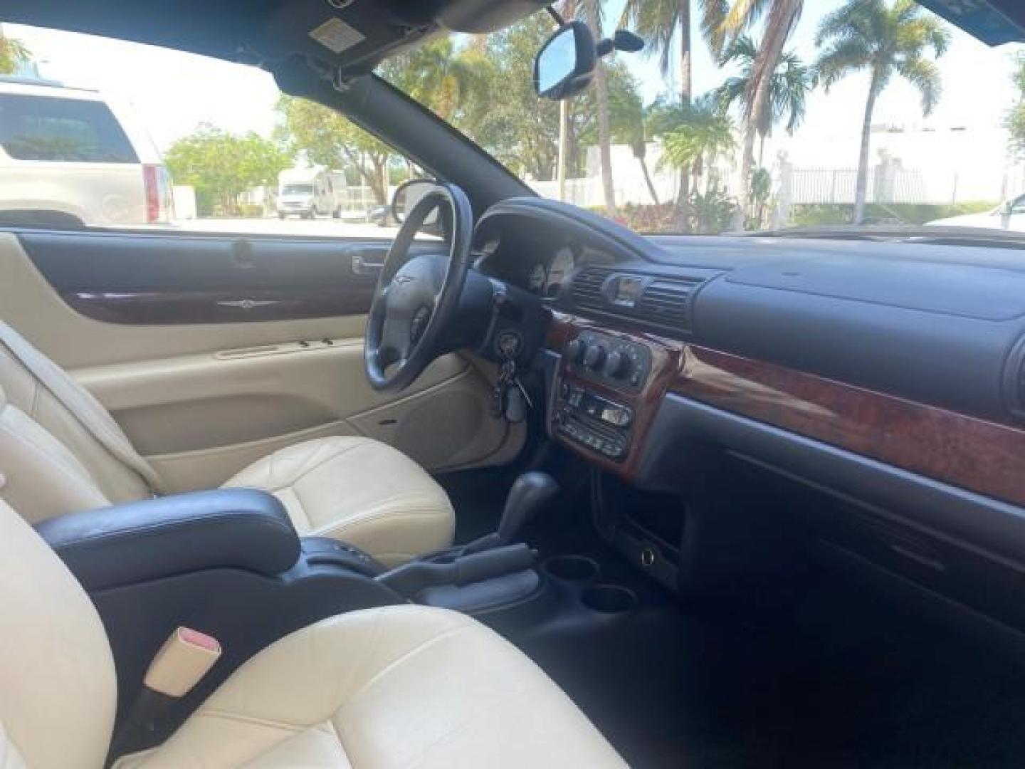 2002 Stone White /Royal Blue/Cream Chrysler Sebring Limited FL LOW MILES 34,440 (1C3EL65R52N) with an 2.7L MFI DOHC 24-Valve V6 Engine engine, Automatic transmission, located at 4701 North Dixie Hwy, Pompano Beach, FL, 33064, (954) 422-2889, 26.240938, -80.123474 - OUR WEBPAGE FLORIDACARS1.COM HAS OVER 100 PHOTOS AND FREE CARFAX LINK 2002 CHRYSLER SEBRING LIMITED VIN: 1C3EL65R52N169318 1 C 3 E L 6 5 R 5 2 N 1 6 9 3 1 8 CONVERTIBLE 2.7L V6 F DOHC GASOLINE FRONT WHEEL DRIVE Top Features Alloy Wheels Soft Top Infinity Sound System Sunroof(s) Leather Seats Basic F - Photo#86