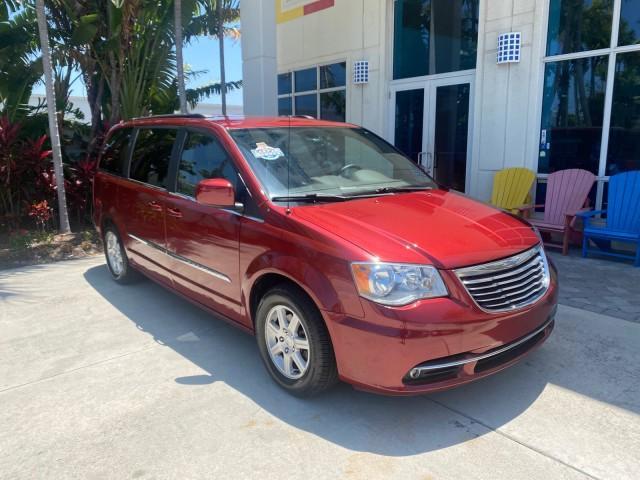 2012 Deep Cherry Red Crystal Pearl /Dark Frost Beige/Medium Frost Beige Interior Chrysler Town and Country 1 OWNER LOW MILES 58.411 (2C4RC1BG4CR) with an 3.6L V6 Cylinder Engine engine, Automatic transmission, located at 4701 North Dixie Hwy, Pompano Beach, FL, 33064, (954) 422-2889, 26.240938, -80.123474 - OUR WEBPAGE FLORIDACARS1.COM HAS OVER 100 PHOTOS AND FREE CARFAX LINK 2012 CHRYSLER TOWN AND COUNTRY TOURING VIN: 2C4RC1BG4CR189972 2 C 4 R C 1 B G 4 C R 1 8 9 9 7 2 VAN 3.6L V6 F DOHC 24V GASOLINE FRONT WHEEL DRIVE Top Features Alloy Wheels Rear Air Conditioning Bluetooth Technology Rear Entertainm - Photo#1