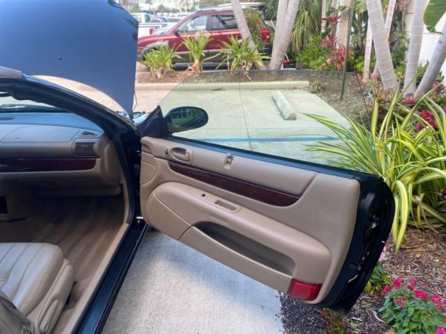 2002 Black /Sandstone Chrysler Sebring LXI 1 OWNER FL LOW MILES 22,632 (1C3EL55R32N) with an 2.7L MFI DOHC 24-Valve V6 Engine engine, Automatic transmission, located at 4701 North Dixie Hwy, Pompano Beach, FL, 33064, (954) 422-2889, 26.240938, -80.123474 - OUR WEBPAGE FLORIDACARS1.COM HAS OVER 100 PHOTOS AND FREE CARFAX LINK 2002 CHRYSLER SEBRING LXI VIN: 1C3EL55R32N294537 1 C 3 E L 5 5 R 3 2 N 2 9 4 5 3 7 CONVERTIBLE 2.7L V6 F DOHC GASOLINE FRONT WHEEL DRIVE Top Features Alloy Wheels Soft Top Cloth Seats Sunroof(s) Basic Features AM/FM Stereo CD Audi - Photo#11