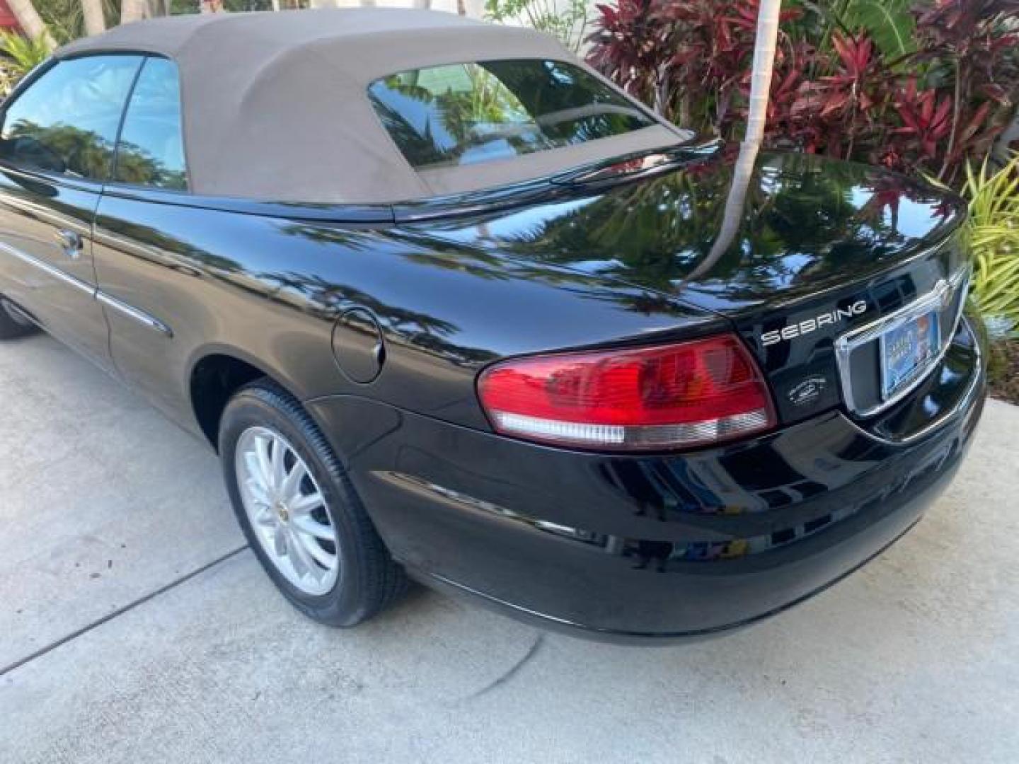 2002 Black /Sandstone Chrysler Sebring LXI 1 OWNER FL LOW MILES 22,632 (1C3EL55R32N) with an 2.7L MFI DOHC 24-Valve V6 Engine engine, Automatic transmission, located at 4701 North Dixie Hwy, Pompano Beach, FL, 33064, (954) 422-2889, 26.240938, -80.123474 - OUR WEBPAGE FLORIDACARS1.COM HAS OVER 100 PHOTOS AND FREE CARFAX LINK 2002 CHRYSLER SEBRING LXI VIN: 1C3EL55R32N294537 1 C 3 E L 5 5 R 3 2 N 2 9 4 5 3 7 CONVERTIBLE 2.7L V6 F DOHC GASOLINE FRONT WHEEL DRIVE Top Features Alloy Wheels Soft Top Cloth Seats Sunroof(s) Basic Features AM/FM Stereo CD Audi - Photo#68