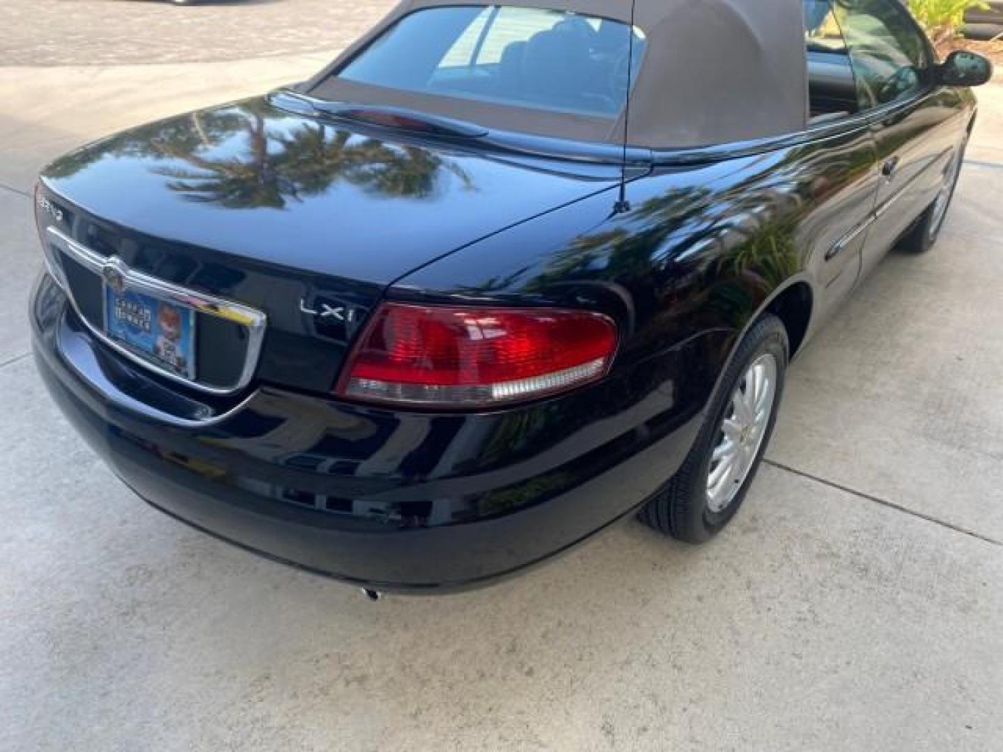 2002 Black /Sandstone Chrysler Sebring LXI 1 OWNER FL LOW MILES 22,632 (1C3EL55R32N) with an 2.7L MFI DOHC 24-Valve V6 Engine engine, Automatic transmission, located at 4701 North Dixie Hwy, Pompano Beach, FL, 33064, (954) 422-2889, 26.240938, -80.123474 - OUR WEBPAGE FLORIDACARS1.COM HAS OVER 100 PHOTOS AND FREE CARFAX LINK 2002 CHRYSLER SEBRING LXI VIN: 1C3EL55R32N294537 1 C 3 E L 5 5 R 3 2 N 2 9 4 5 3 7 CONVERTIBLE 2.7L V6 F DOHC GASOLINE FRONT WHEEL DRIVE Top Features Alloy Wheels Soft Top Cloth Seats Sunroof(s) Basic Features AM/FM Stereo CD Audi - Photo#70