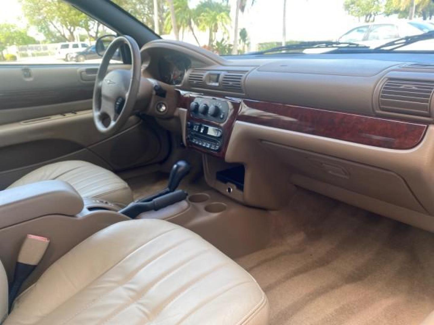 2002 Black /Sandstone Chrysler Sebring LXI 1 OWNER FL LOW MILES 22,632 (1C3EL55R32N) with an 2.7L MFI DOHC 24-Valve V6 Engine engine, Automatic transmission, located at 4701 North Dixie Hwy, Pompano Beach, FL, 33064, (954) 422-2889, 26.240938, -80.123474 - OUR WEBPAGE FLORIDACARS1.COM HAS OVER 100 PHOTOS AND FREE CARFAX LINK 2002 CHRYSLER SEBRING LXI VIN: 1C3EL55R32N294537 1 C 3 E L 5 5 R 3 2 N 2 9 4 5 3 7 CONVERTIBLE 2.7L V6 F DOHC GASOLINE FRONT WHEEL DRIVE Top Features Alloy Wheels Soft Top Cloth Seats Sunroof(s) Basic Features AM/FM Stereo CD Audi - Photo#84