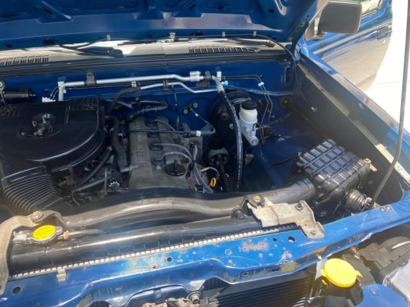 2002 Electric Blue Metallic /Gray Nissan Frontier 2WD XE FL LOW MILES 73,028 (1N6DD26S92C) with an 2.4L DOHC SMPI 16-Valve 4-Cyl Engine engine, Automatic transmission, located at 4701 North Dixie Hwy, Pompano Beach, FL, 33064, (954) 422-2889, 26.240938, -80.123474 - OUR WEBPAGE FLORIDACARS1.COM HAS OVER 100 PHOTOS AND FREE CARFAX LINK 2002 NISSAN FRONTIER XE VIN: 1N6DD26S92C366273 1 N 6 D D 2 6 S 9 2 C 3 6 6 2 7 3 CLUB CAB PICKUP 2.4L I4 F DOHC 16V GASOLINE REAR WHEEL DRIVE Top Features Alloy Wheels Cloth Seats Bed Liner Basic Features ABS Brakes Air Conditioni - Photo#26