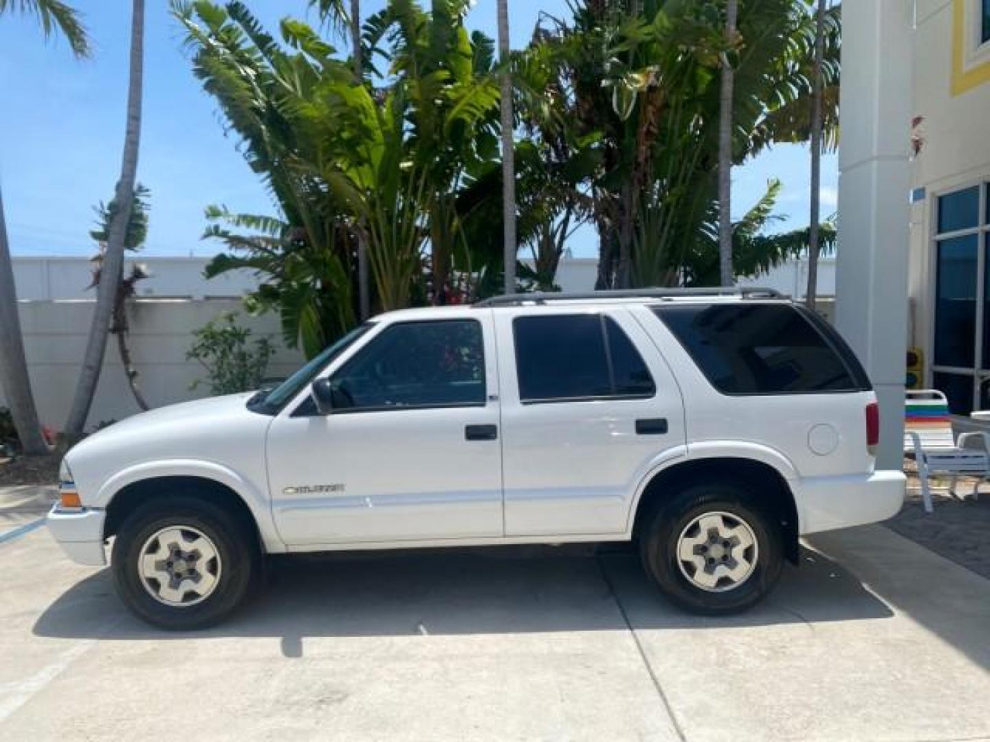 2003 Summit White /Medium Gray Chevrolet Blazer LS 4WD LOW MILES 71,072 (1GNDT13X33K) with an 4.3L Vortec 4300 V6 MFI Engine engine, Automatic transmission, located at 4701 North Dixie Hwy, Pompano Beach, FL, 33064, (954) 422-2889, 26.240938, -80.123474 - OUR WEBPAGE FLORIDACARS1.COM HAS OVER 100 PHOTOS AND FREE CARFAX LINK 2003 CHEVROLET BLAZER LS VIN: 1GNDT13X33K114534 1 G N D T 1 3 X 3 3 K 1 1 4 5 3 4 4 DOOR WAGON/SPORT UTILITY 4.3L V6 F OHV 12V GASOLINE REAR WHEEL DRIVE W/ 4X4 Top Features 4WD/AWD Alloy Wheels Cloth Seats Basic Features ABS Brake - Photo#4