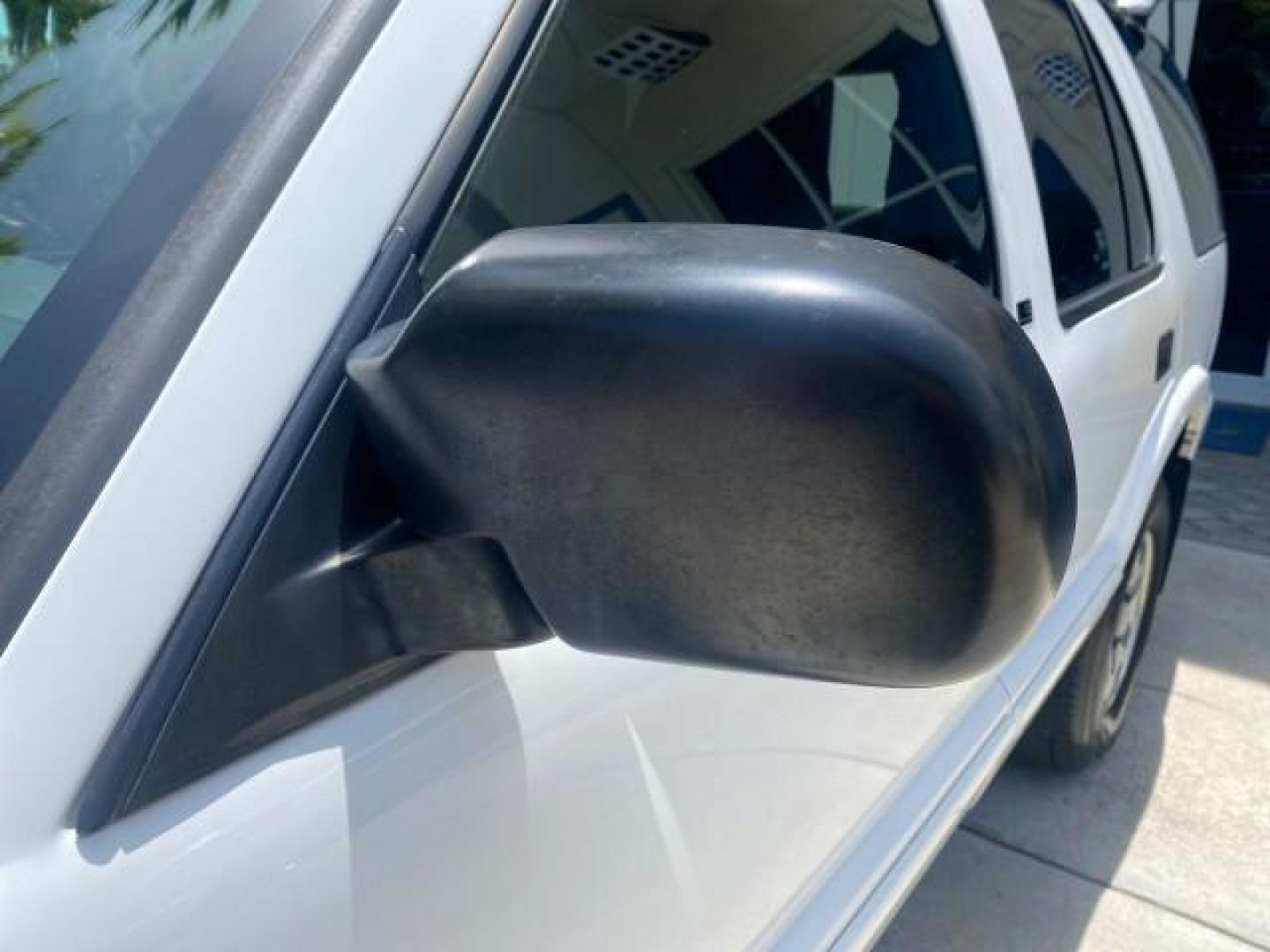 2003 Summit White /Medium Gray Chevrolet Blazer LS 4WD LOW MILES 71,072 (1GNDT13X33K) with an 4.3L Vortec 4300 V6 MFI Engine engine, Automatic transmission, located at 4701 North Dixie Hwy, Pompano Beach, FL, 33064, (954) 422-2889, 26.240938, -80.123474 - OUR WEBPAGE FLORIDACARS1.COM HAS OVER 100 PHOTOS AND FREE CARFAX LINK 2003 CHEVROLET BLAZER LS VIN: 1GNDT13X33K114534 1 G N D T 1 3 X 3 3 K 1 1 4 5 3 4 4 DOOR WAGON/SPORT UTILITY 4.3L V6 F OHV 12V GASOLINE REAR WHEEL DRIVE W/ 4X4 Top Features 4WD/AWD Alloy Wheels Cloth Seats Basic Features ABS Brake - Photo#32