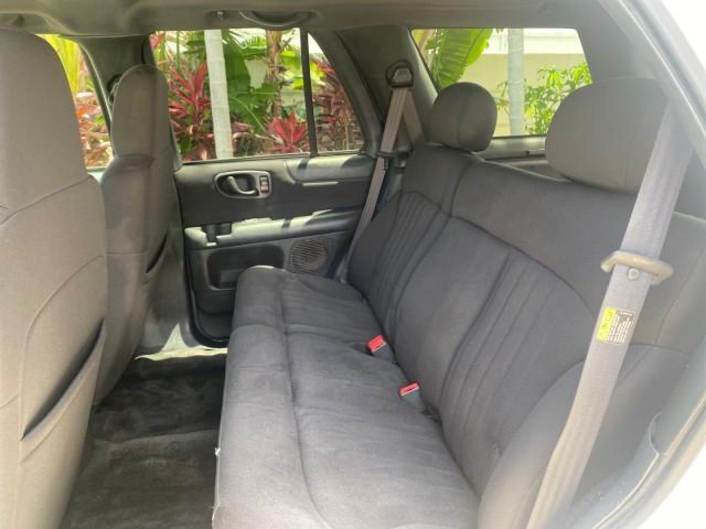 2003 Summit White /Medium Gray Chevrolet Blazer LS 4WD LOW MILES 71,072 (1GNDT13X33K) with an 4.3L Vortec 4300 V6 MFI Engine engine, Automatic transmission, located at 4701 North Dixie Hwy, Pompano Beach, FL, 33064, (954) 422-2889, 26.240938, -80.123474 - OUR WEBPAGE FLORIDACARS1.COM HAS OVER 100 PHOTOS AND FREE CARFAX LINK 2003 CHEVROLET BLAZER LS VIN: 1GNDT13X33K114534 1 G N D T 1 3 X 3 3 K 1 1 4 5 3 4 4 DOOR WAGON/SPORT UTILITY 4.3L V6 F OHV 12V GASOLINE REAR WHEEL DRIVE W/ 4X4 Top Features 4WD/AWD Alloy Wheels Cloth Seats Basic Features ABS Brake - Photo#63