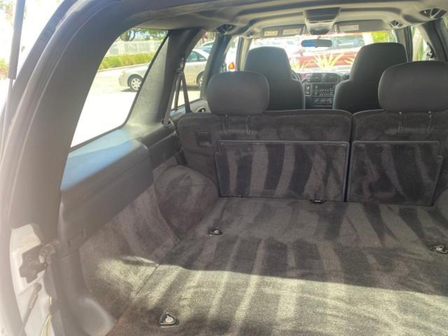 2003 Summit White /Medium Gray Chevrolet Blazer LS 4WD LOW MILES 71,072 (1GNDT13X33K) with an 4.3L Vortec 4300 V6 MFI Engine engine, Automatic transmission, located at 4701 North Dixie Hwy, Pompano Beach, FL, 33064, (954) 422-2889, 26.240938, -80.123474 - OUR WEBPAGE FLORIDACARS1.COM HAS OVER 100 PHOTOS AND FREE CARFAX LINK 2003 CHEVROLET BLAZER LS VIN: 1GNDT13X33K114534 1 G N D T 1 3 X 3 3 K 1 1 4 5 3 4 4 DOOR WAGON/SPORT UTILITY 4.3L V6 F OHV 12V GASOLINE REAR WHEEL DRIVE W/ 4X4 Top Features 4WD/AWD Alloy Wheels Cloth Seats Basic Features ABS Brake - Photo#82