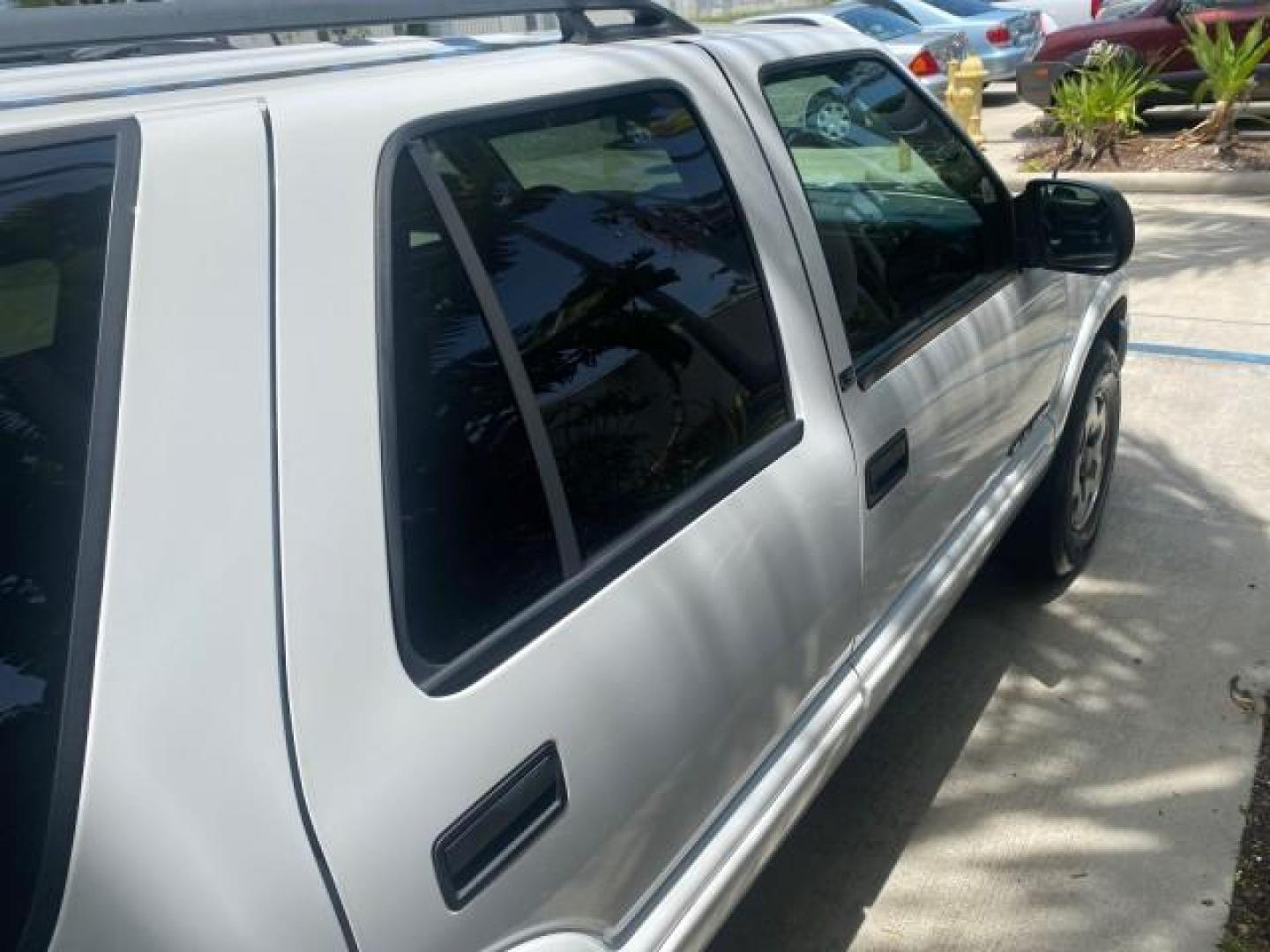 2003 Summit White /Medium Gray Chevrolet Blazer LS 4WD LOW MILES 71,072 (1GNDT13X33K) with an 4.3L Vortec 4300 V6 MFI Engine engine, Automatic transmission, located at 4701 North Dixie Hwy, Pompano Beach, FL, 33064, (954) 422-2889, 26.240938, -80.123474 - OUR WEBPAGE FLORIDACARS1.COM HAS OVER 100 PHOTOS AND FREE CARFAX LINK 2003 CHEVROLET BLAZER LS VIN: 1GNDT13X33K114534 1 G N D T 1 3 X 3 3 K 1 1 4 5 3 4 4 DOOR WAGON/SPORT UTILITY 4.3L V6 F OHV 12V GASOLINE REAR WHEEL DRIVE W/ 4X4 Top Features 4WD/AWD Alloy Wheels Cloth Seats Basic Features ABS Brake - Photo#90