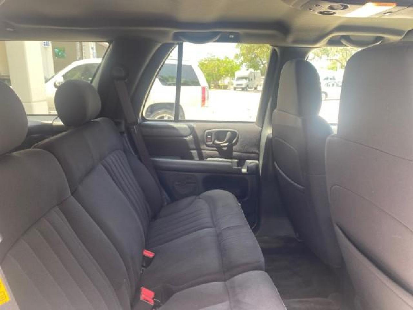 2003 Summit White /Medium Gray Chevrolet Blazer LS 4WD LOW MILES 71,072 (1GNDT13X33K) with an 4.3L Vortec 4300 V6 MFI Engine engine, Automatic transmission, located at 4701 North Dixie Hwy, Pompano Beach, FL, 33064, (954) 422-2889, 26.240938, -80.123474 - OUR WEBPAGE FLORIDACARS1.COM HAS OVER 100 PHOTOS AND FREE CARFAX LINK 2003 CHEVROLET BLAZER LS VIN: 1GNDT13X33K114534 1 G N D T 1 3 X 3 3 K 1 1 4 5 3 4 4 DOOR WAGON/SPORT UTILITY 4.3L V6 F OHV 12V GASOLINE REAR WHEEL DRIVE W/ 4X4 Top Features 4WD/AWD Alloy Wheels Cloth Seats Basic Features ABS Brake - Photo#95