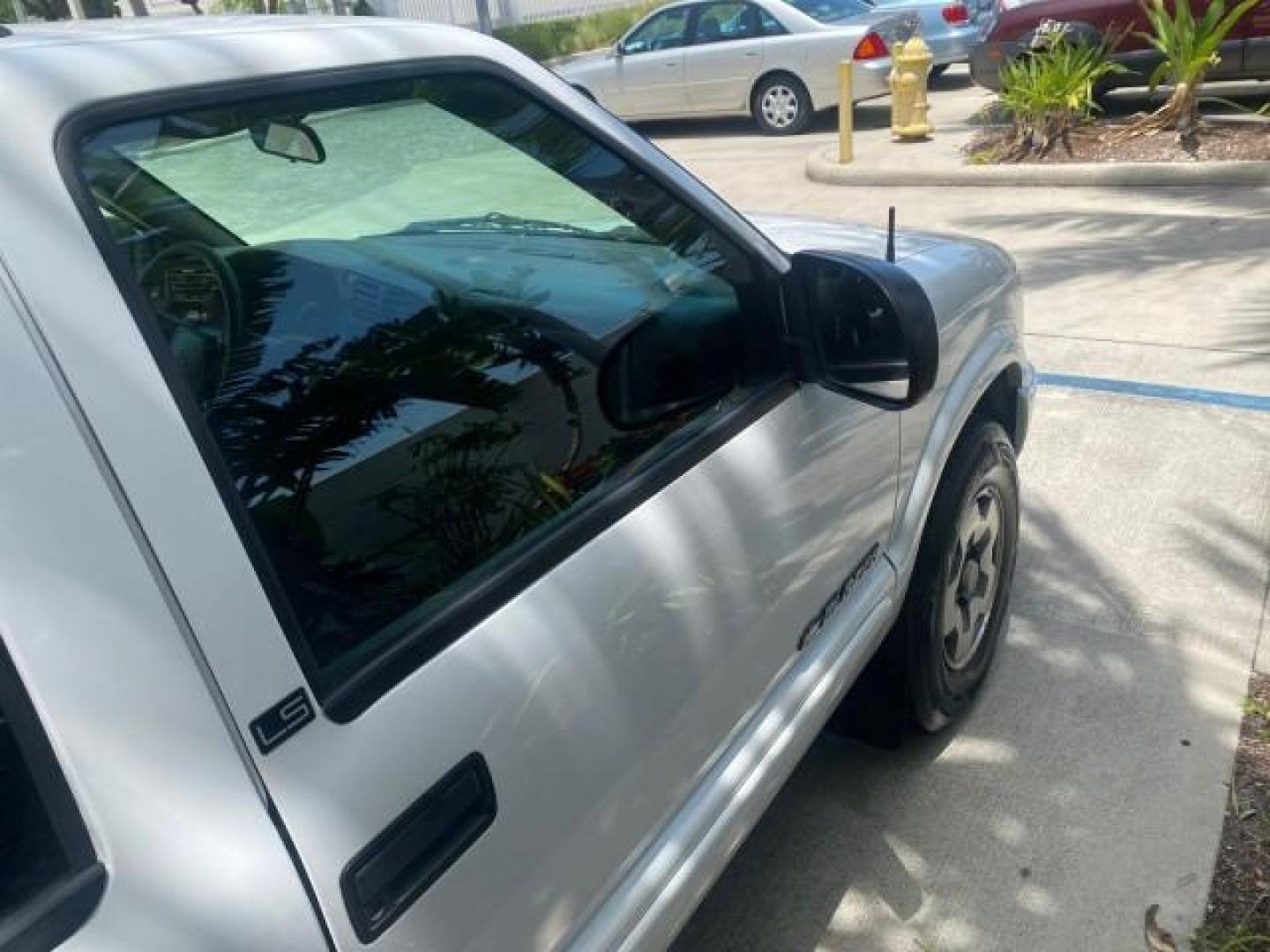 2003 Summit White /Medium Gray Chevrolet Blazer LS 4WD LOW MILES 71,072 (1GNDT13X33K) with an 4.3L Vortec 4300 V6 MFI Engine engine, Automatic transmission, located at 4701 North Dixie Hwy, Pompano Beach, FL, 33064, (954) 422-2889, 26.240938, -80.123474 - OUR WEBPAGE FLORIDACARS1.COM HAS OVER 100 PHOTOS AND FREE CARFAX LINK 2003 CHEVROLET BLAZER LS VIN: 1GNDT13X33K114534 1 G N D T 1 3 X 3 3 K 1 1 4 5 3 4 4 DOOR WAGON/SPORT UTILITY 4.3L V6 F OHV 12V GASOLINE REAR WHEEL DRIVE W/ 4X4 Top Features 4WD/AWD Alloy Wheels Cloth Seats Basic Features ABS Brake - Photo#97