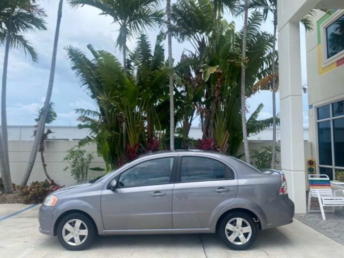 2011 Medium Gray /Charcoal Chevrolet Aveo LS LOW MILES 18,701 (KL1TD5DE5BB) with an Ecotec 1.6L DOHC 16-Valve 4-Cyl MFI Engine engine, Automatic transmission, located at 4701 North Dixie Hwy, Pompano Beach, FL, 33064, (954) 422-2889, 26.240938, -80.123474 - OUR WEBPAGE FLORIDACARS1.COM HAS OVER 100 PHOTOS AND FREE CARFAX LINK 2011 CHEVROLET AVEO LT VIN: KL1TD5DE5BB141987 K L 1 T D 5 D E 5 B B 1 4 1 9 8 7 SEDAN 4 DR 1.6L I4 F DOHC 16V GASOLINE 35 MPG FRONT WHEEL DRIVE Top Features Cloth Seats Basic Features AM/FM Stereo Automatic Transmission Cruise Con - Photo#4