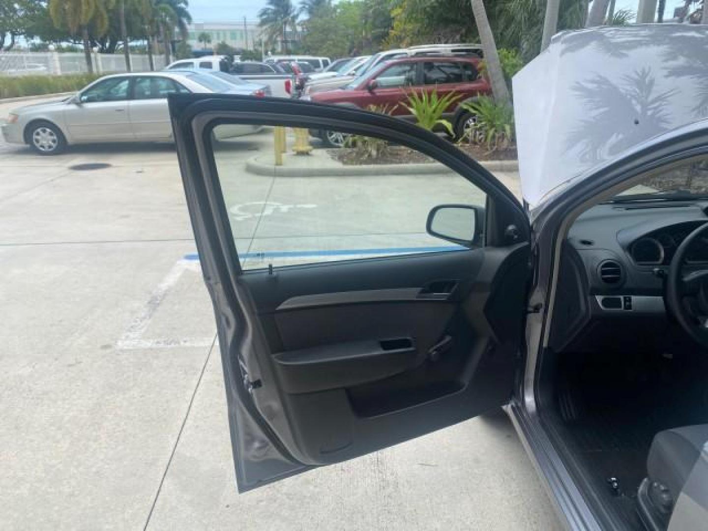 2011 Medium Gray /Charcoal Chevrolet Aveo LS LOW MILES 18,701 (KL1TD5DE5BB) with an Ecotec 1.6L DOHC 16-Valve 4-Cyl MFI Engine engine, Automatic transmission, located at 4701 North Dixie Hwy, Pompano Beach, FL, 33064, (954) 422-2889, 26.240938, -80.123474 - OUR WEBPAGE FLORIDACARS1.COM HAS OVER 100 PHOTOS AND FREE CARFAX LINK 2011 CHEVROLET AVEO LT VIN: KL1TD5DE5BB141987 K L 1 T D 5 D E 5 B B 1 4 1 9 8 7 SEDAN 4 DR 1.6L I4 F DOHC 16V GASOLINE 35 MPG FRONT WHEEL DRIVE Top Features Cloth Seats Basic Features AM/FM Stereo Automatic Transmission Cruise Con - Photo#9