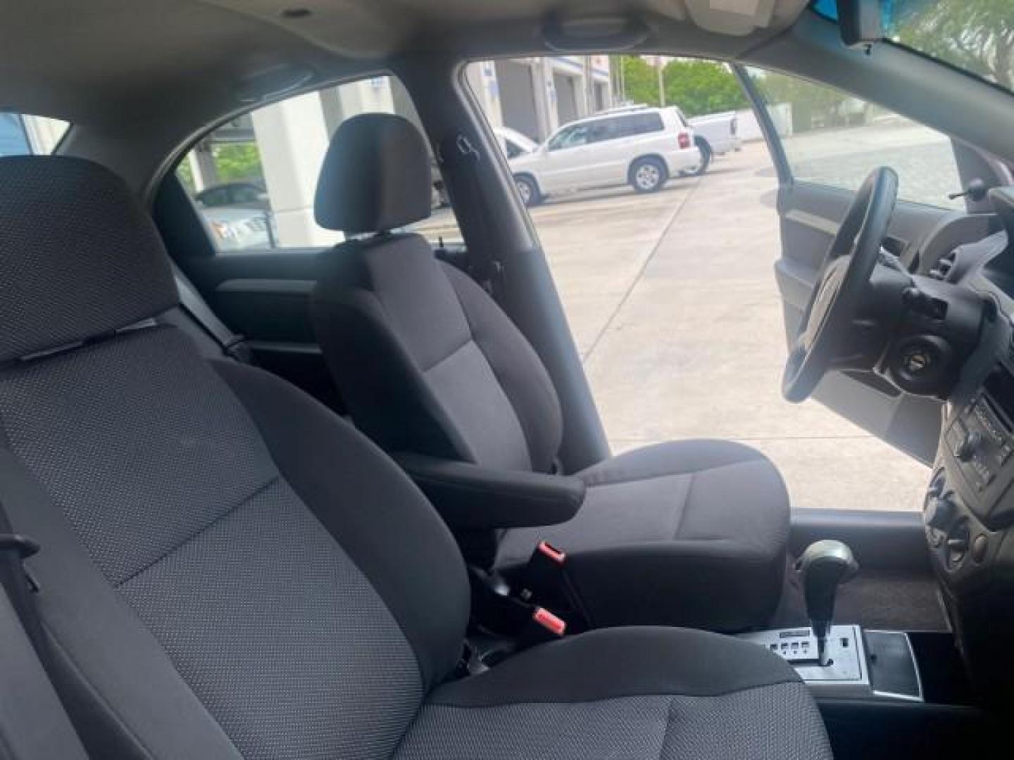 2011 Medium Gray /Charcoal Chevrolet Aveo LS LOW MILES 18,701 (KL1TD5DE5BB) with an Ecotec 1.6L DOHC 16-Valve 4-Cyl MFI Engine engine, Automatic transmission, located at 4701 North Dixie Hwy, Pompano Beach, FL, 33064, (954) 422-2889, 26.240938, -80.123474 - OUR WEBPAGE FLORIDACARS1.COM HAS OVER 100 PHOTOS AND FREE CARFAX LINK 2011 CHEVROLET AVEO LT VIN: KL1TD5DE5BB141987 K L 1 T D 5 D E 5 B B 1 4 1 9 8 7 SEDAN 4 DR 1.6L I4 F DOHC 16V GASOLINE 35 MPG FRONT WHEEL DRIVE Top Features Cloth Seats Basic Features AM/FM Stereo Automatic Transmission Cruise Con - Photo#12
