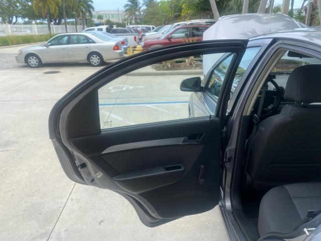 2011 Medium Gray /Charcoal Chevrolet Aveo LS LOW MILES 18,766 (KL1TD5DE5BB) with an Ecotec 1.6L DOHC 16-Valve 4-Cyl MFI Engine engine, Automatic transmission, located at 4701 North Dixie Hwy, Pompano Beach, FL, 33064, (954) 422-2889, 26.240938, -80.123474 - OUR WEBPAGE FLORIDACARS1.COM HAS OVER 100 PHOTOS AND FREE CARFAX LINK 2011 CHEVROLET AVEO LT VIN: KL1TD5DE5BB141987 K L 1 T D 5 D E 5 B B 1 4 1 9 8 7 SEDAN 4 DR 1.6L I4 F DOHC 16V GASOLINE 35 MPG FRONT WHEEL DRIVE Top Features Cloth Seats Basic Features AM/FM Stereo Automatic Transmission Cruise Con - Photo#13