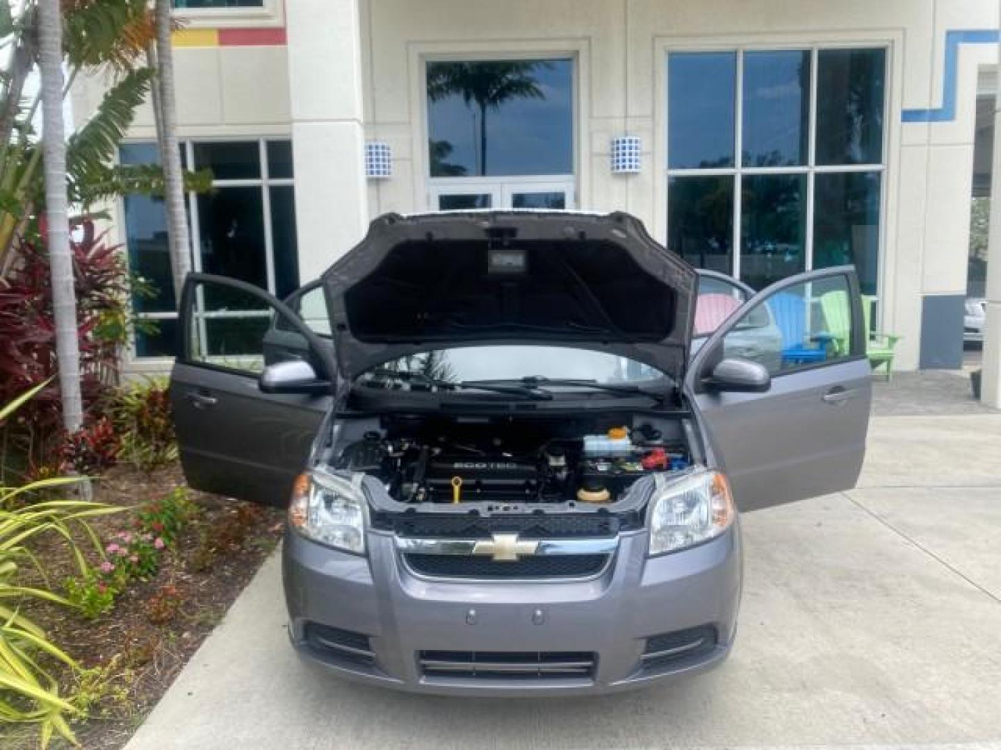 2011 Medium Gray /Charcoal Chevrolet Aveo LS LOW MILES 18,701 (KL1TD5DE5BB) with an Ecotec 1.6L DOHC 16-Valve 4-Cyl MFI Engine engine, Automatic transmission, located at 4701 North Dixie Hwy, Pompano Beach, FL, 33064, (954) 422-2889, 26.240938, -80.123474 - OUR WEBPAGE FLORIDACARS1.COM HAS OVER 100 PHOTOS AND FREE CARFAX LINK 2011 CHEVROLET AVEO LT VIN: KL1TD5DE5BB141987 K L 1 T D 5 D E 5 B B 1 4 1 9 8 7 SEDAN 4 DR 1.6L I4 F DOHC 16V GASOLINE 35 MPG FRONT WHEEL DRIVE Top Features Cloth Seats Basic Features AM/FM Stereo Automatic Transmission Cruise Con - Photo#16