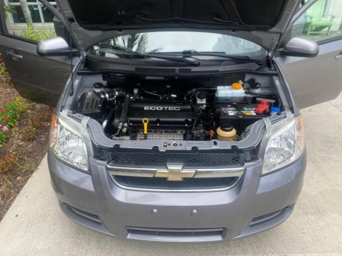 2011 Medium Gray /Charcoal Chevrolet Aveo LS LOW MILES 18,701 (KL1TD5DE5BB) with an Ecotec 1.6L DOHC 16-Valve 4-Cyl MFI Engine engine, Automatic transmission, located at 4701 North Dixie Hwy, Pompano Beach, FL, 33064, (954) 422-2889, 26.240938, -80.123474 - OUR WEBPAGE FLORIDACARS1.COM HAS OVER 100 PHOTOS AND FREE CARFAX LINK 2011 CHEVROLET AVEO LT VIN: KL1TD5DE5BB141987 K L 1 T D 5 D E 5 B B 1 4 1 9 8 7 SEDAN 4 DR 1.6L I4 F DOHC 16V GASOLINE 35 MPG FRONT WHEEL DRIVE Top Features Cloth Seats Basic Features AM/FM Stereo Automatic Transmission Cruise Con - Photo#17