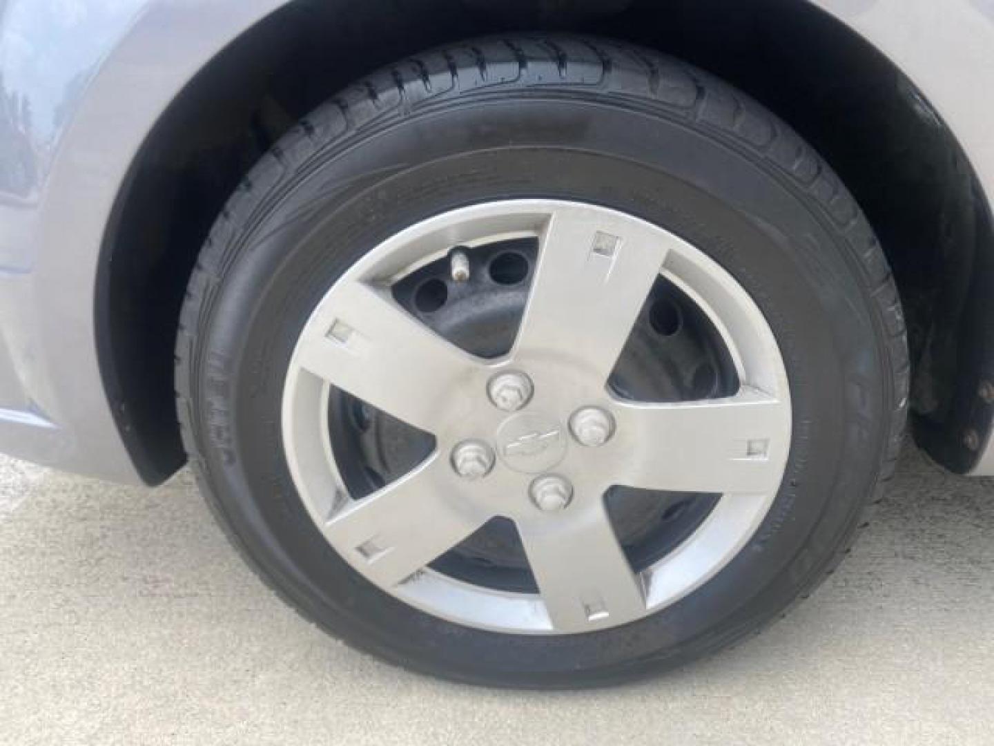 2011 Medium Gray /Charcoal Chevrolet Aveo LS LOW MILES 18,701 (KL1TD5DE5BB) with an Ecotec 1.6L DOHC 16-Valve 4-Cyl MFI Engine engine, Automatic transmission, located at 4701 North Dixie Hwy, Pompano Beach, FL, 33064, (954) 422-2889, 26.240938, -80.123474 - OUR WEBPAGE FLORIDACARS1.COM HAS OVER 100 PHOTOS AND FREE CARFAX LINK 2011 CHEVROLET AVEO LT VIN: KL1TD5DE5BB141987 K L 1 T D 5 D E 5 B B 1 4 1 9 8 7 SEDAN 4 DR 1.6L I4 F DOHC 16V GASOLINE 35 MPG FRONT WHEEL DRIVE Top Features Cloth Seats Basic Features AM/FM Stereo Automatic Transmission Cruise Con - Photo#19