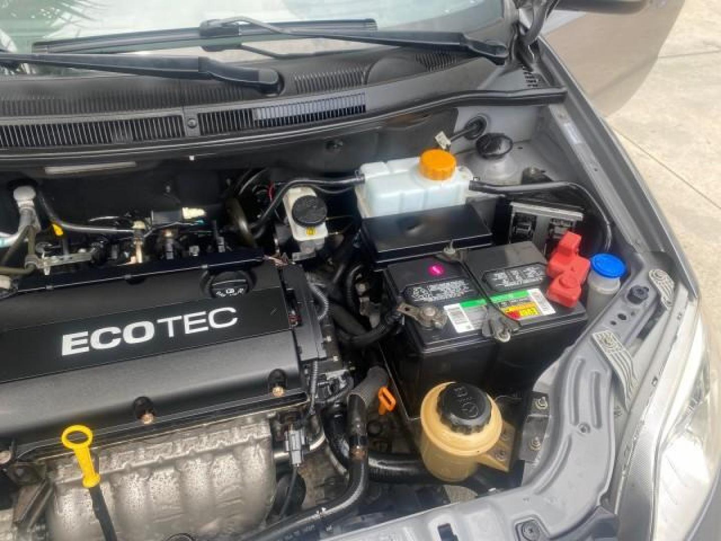 2011 Medium Gray /Charcoal Chevrolet Aveo LS LOW MILES 18,701 (KL1TD5DE5BB) with an Ecotec 1.6L DOHC 16-Valve 4-Cyl MFI Engine engine, Automatic transmission, located at 4701 North Dixie Hwy, Pompano Beach, FL, 33064, (954) 422-2889, 26.240938, -80.123474 - OUR WEBPAGE FLORIDACARS1.COM HAS OVER 100 PHOTOS AND FREE CARFAX LINK 2011 CHEVROLET AVEO LT VIN: KL1TD5DE5BB141987 K L 1 T D 5 D E 5 B B 1 4 1 9 8 7 SEDAN 4 DR 1.6L I4 F DOHC 16V GASOLINE 35 MPG FRONT WHEEL DRIVE Top Features Cloth Seats Basic Features AM/FM Stereo Automatic Transmission Cruise Con - Photo#26